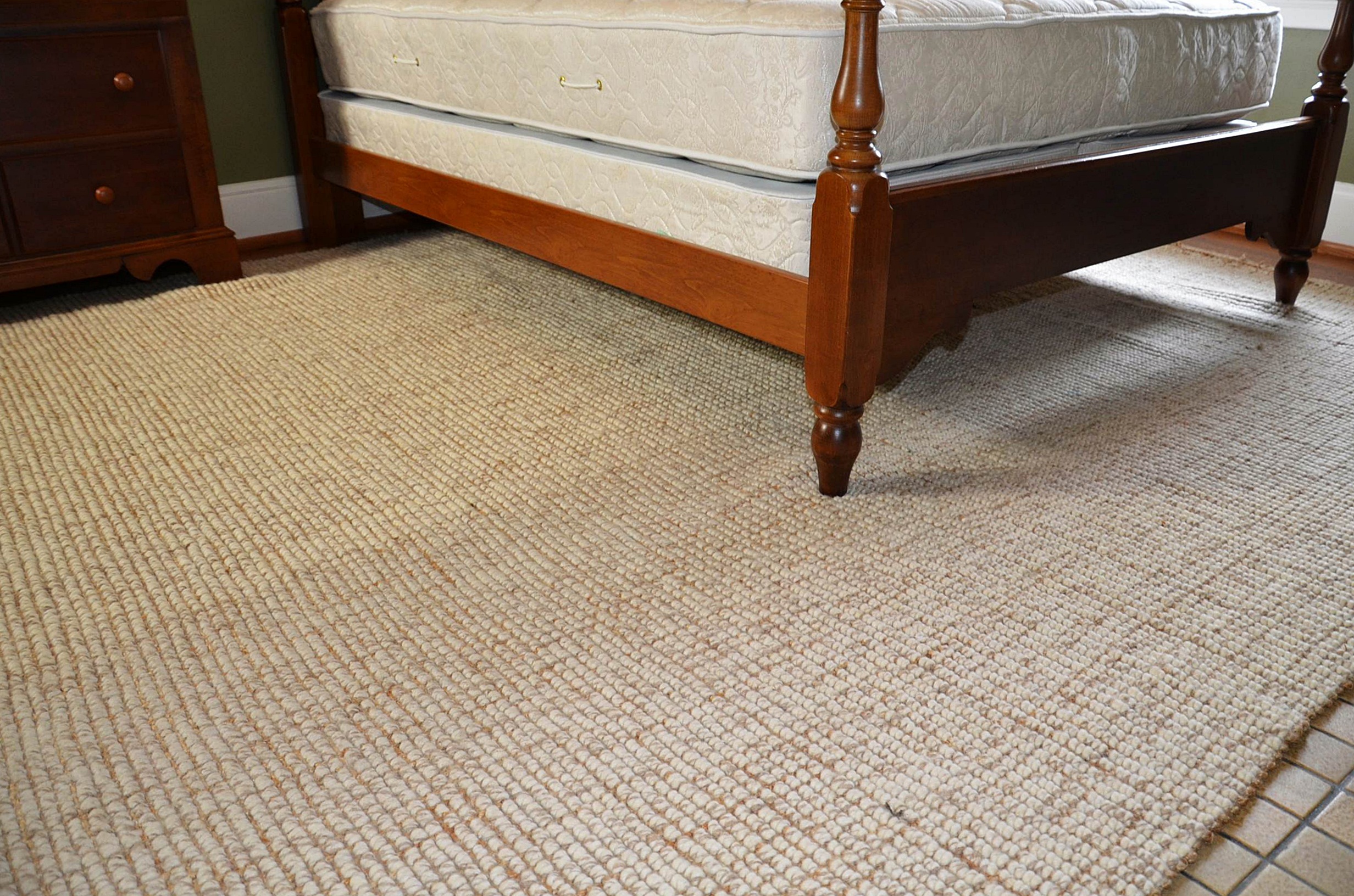 Neutral wool area rug.