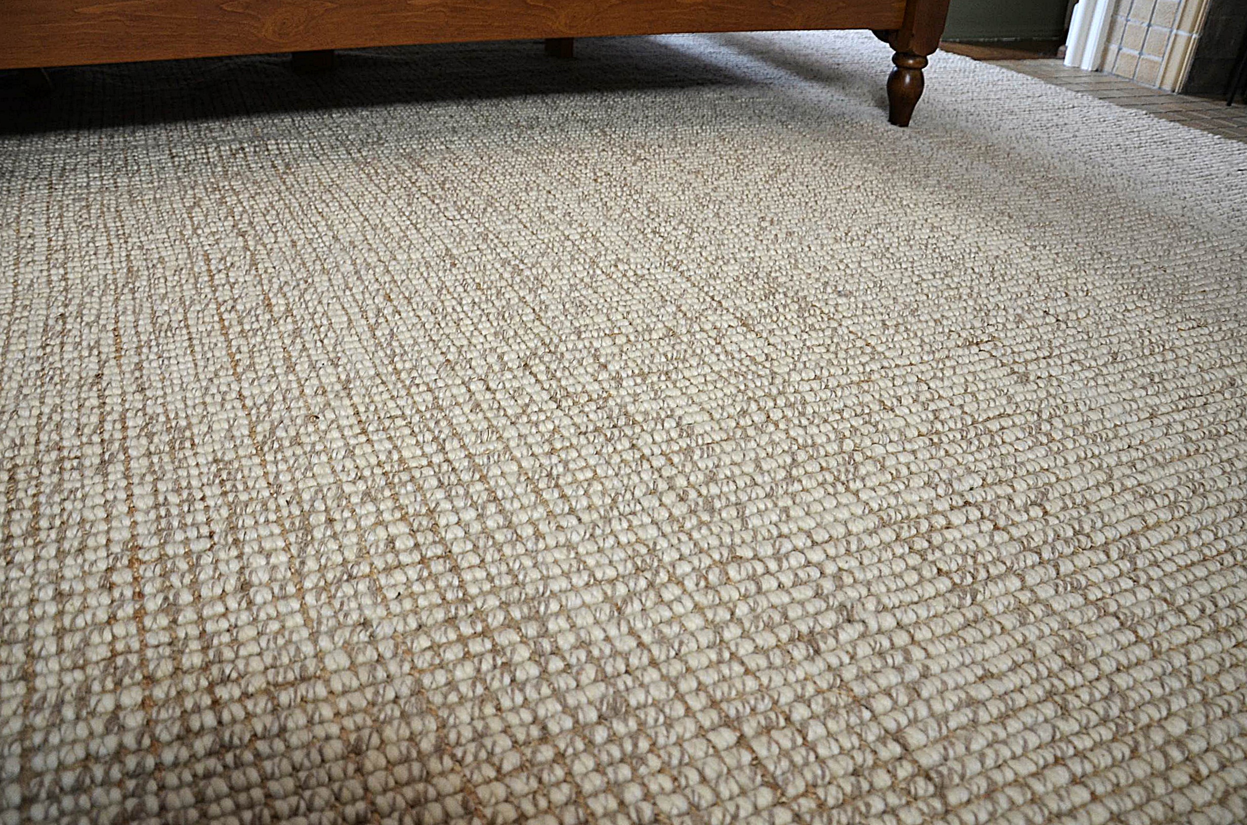 Neutral wool area rug.
