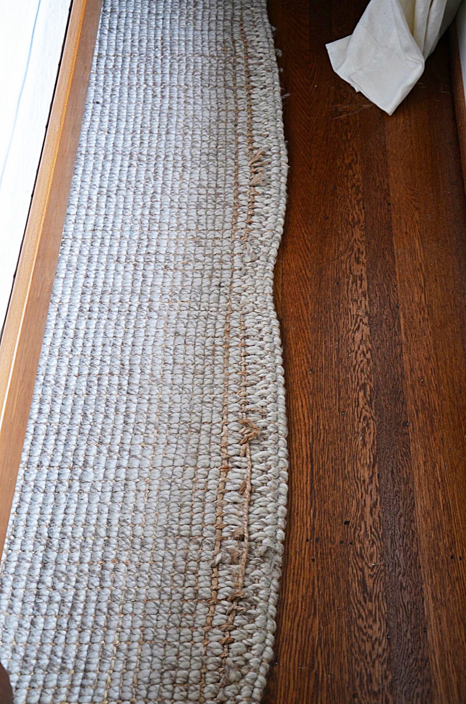 Neutral wool area rug.