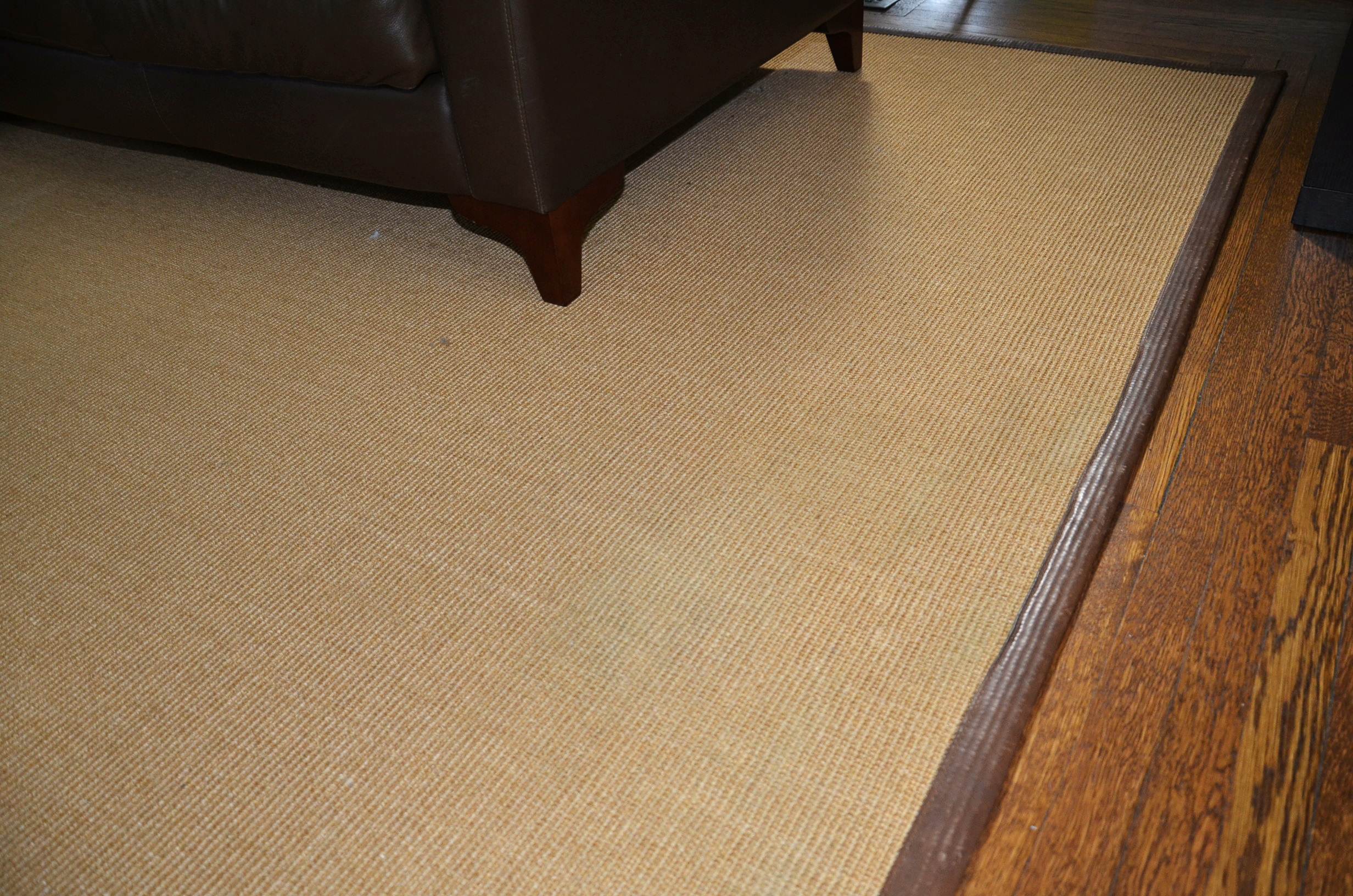 Restoration Hardware sisal rug with leather border.