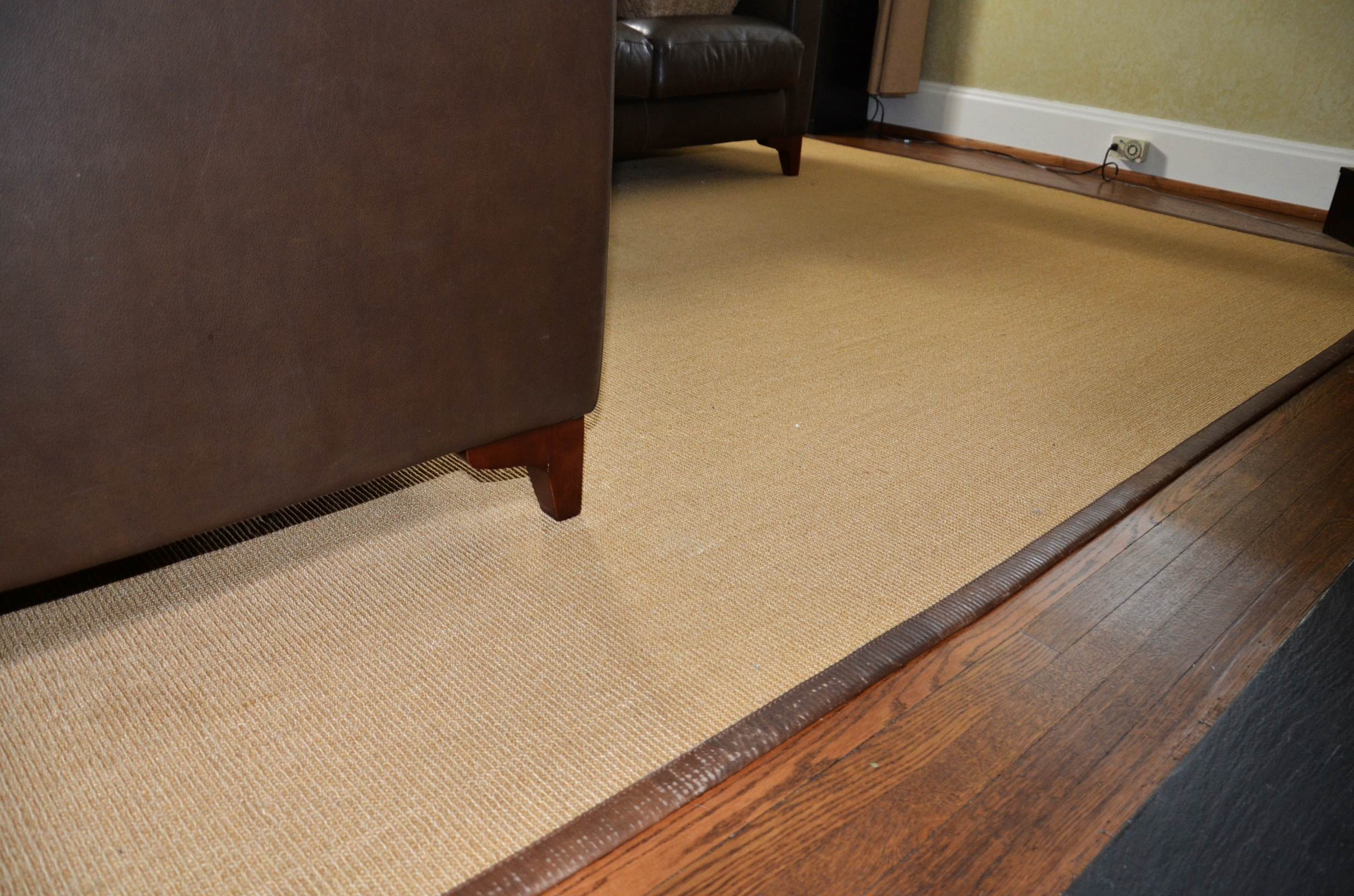 Restoration Hardware sisal rug with leather border.