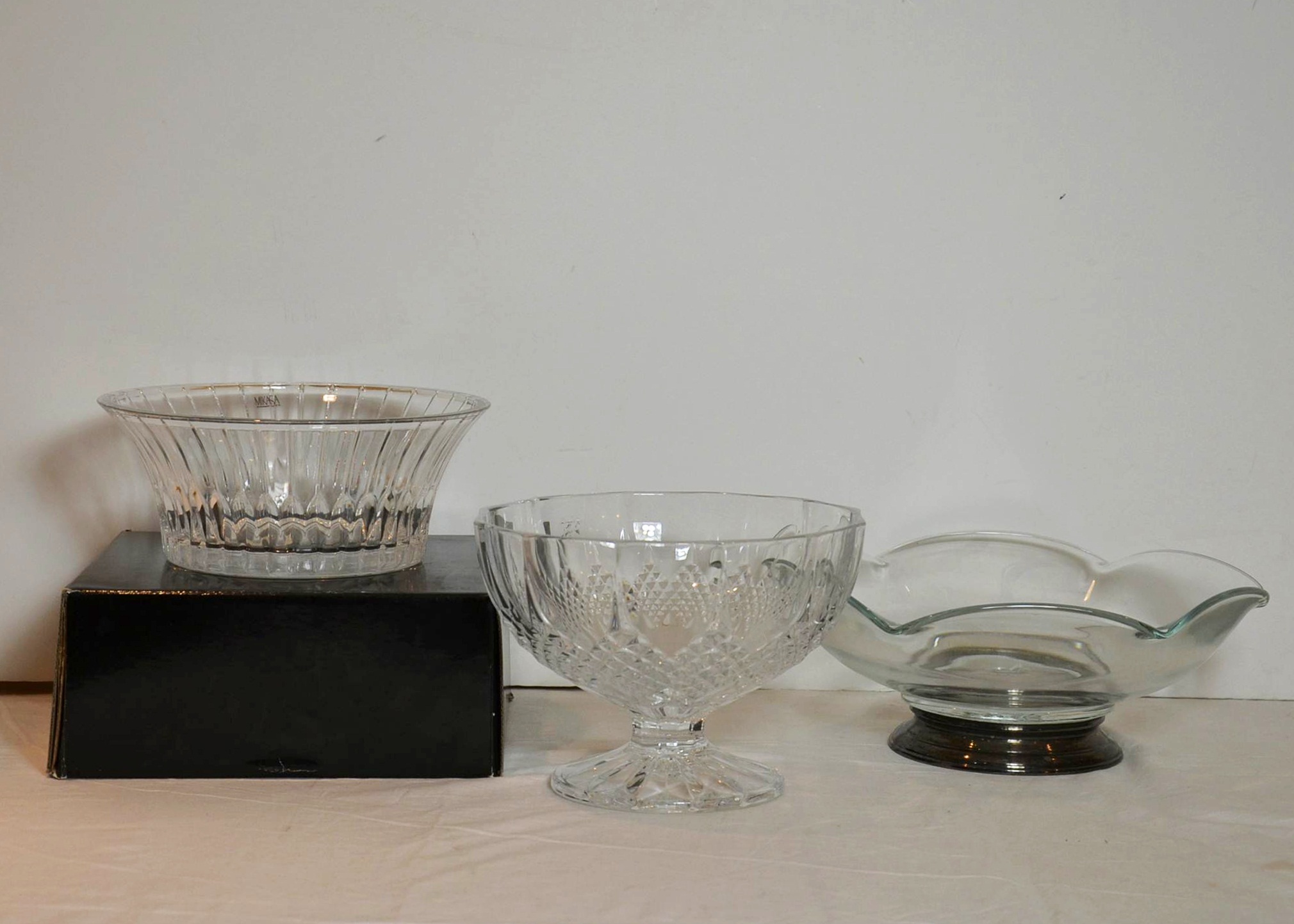 Three crystal serving bowls.