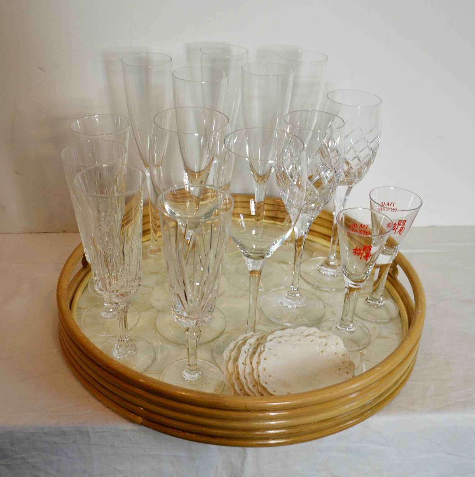 Oyster shell serving tray with stemware and coasters. 