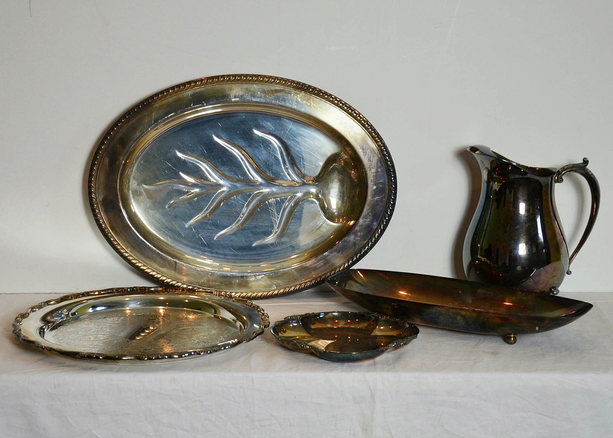 Silver plate serving items.