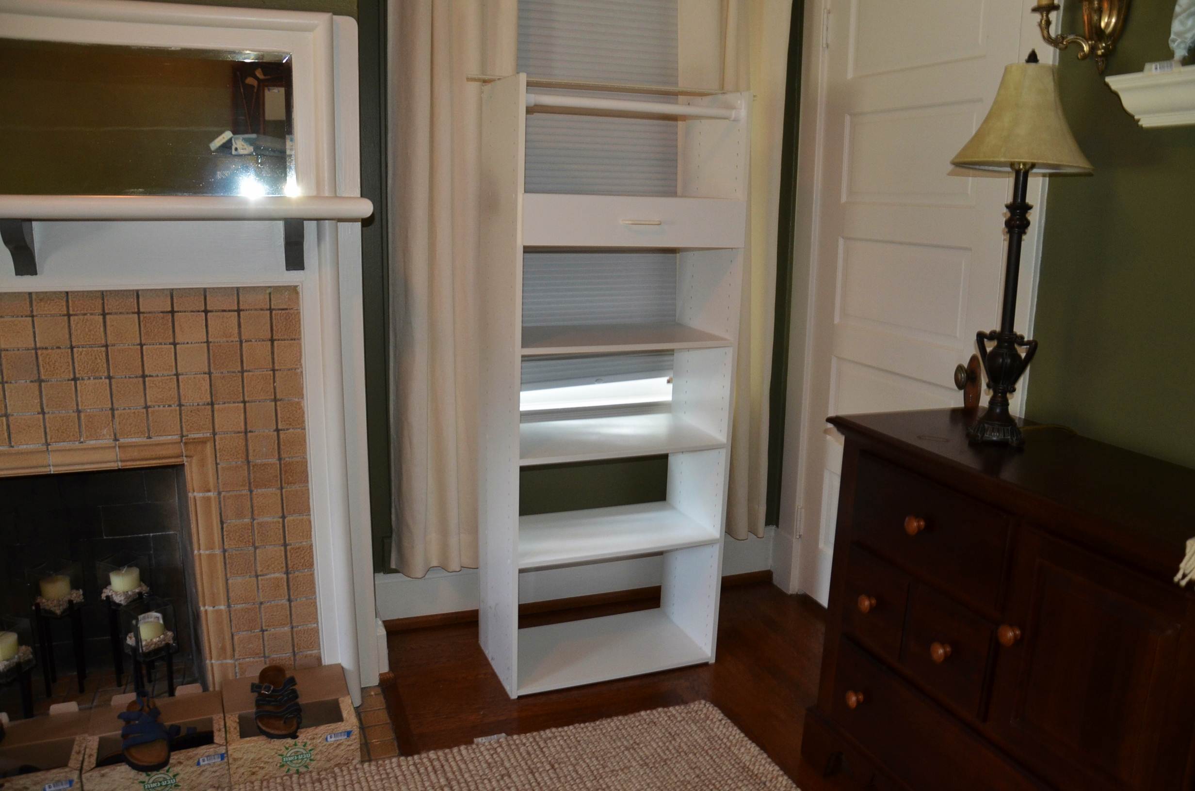 White laminate shelving unit.