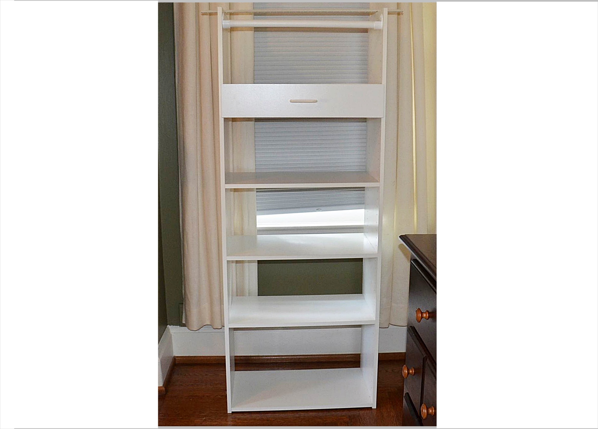 White laminate shelving unit.