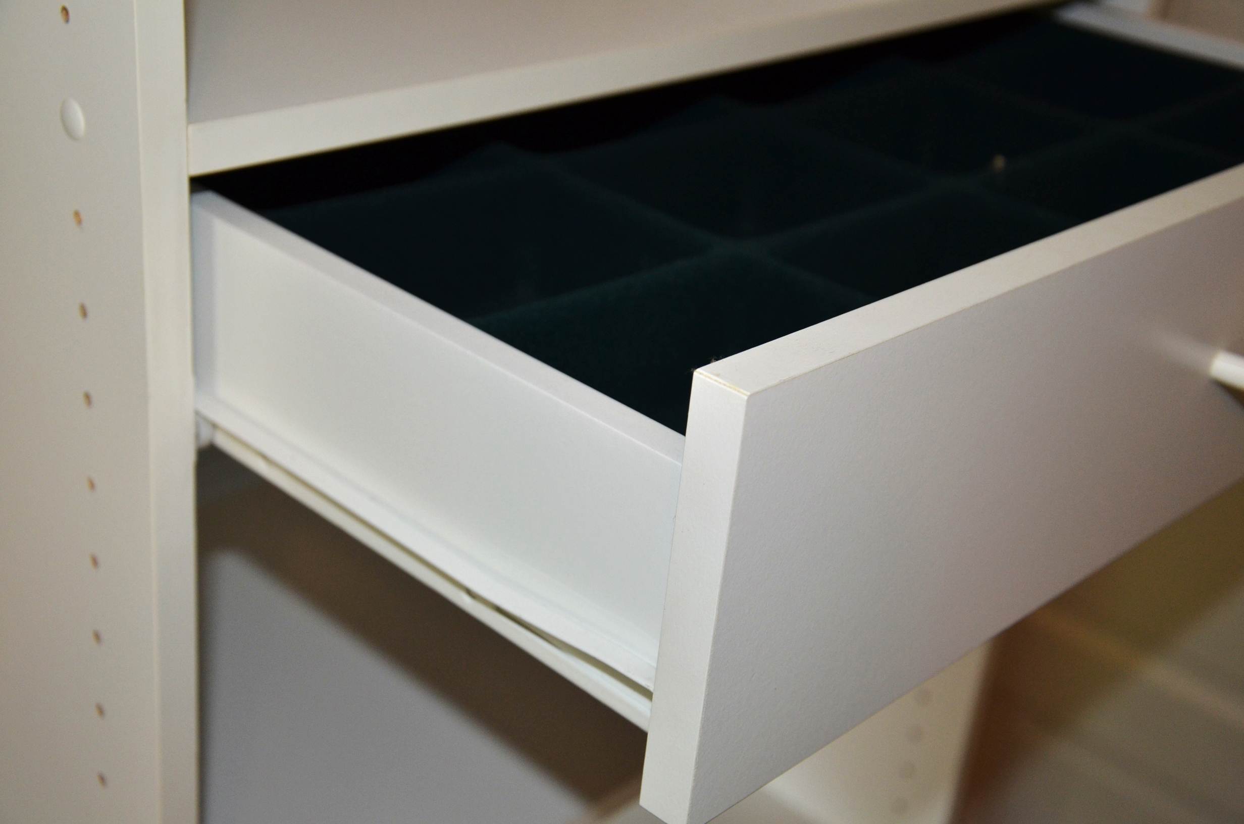 White laminate shelving unit.