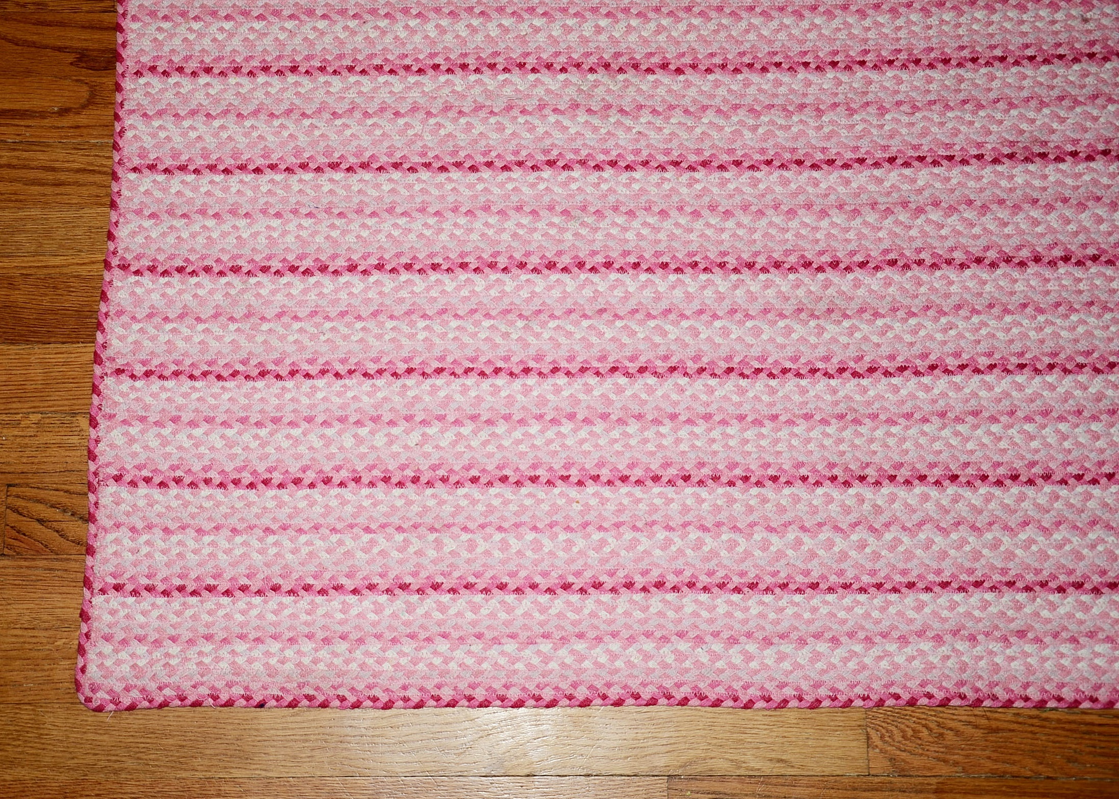 Machine made braided area rug.