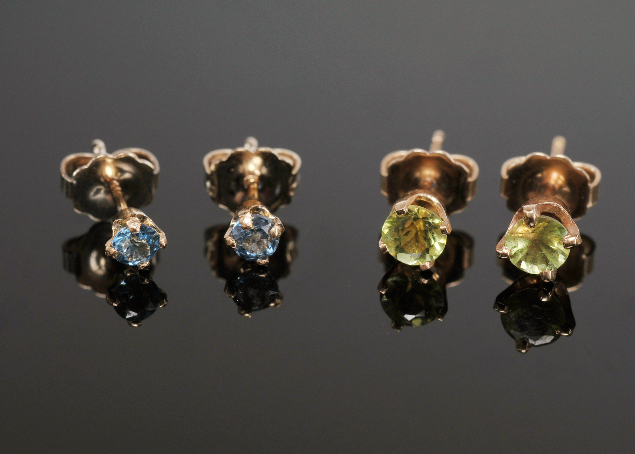 Two pair of Lady's 14 K Yellow Gold Peridot And Blue Topaz Post Earrings 