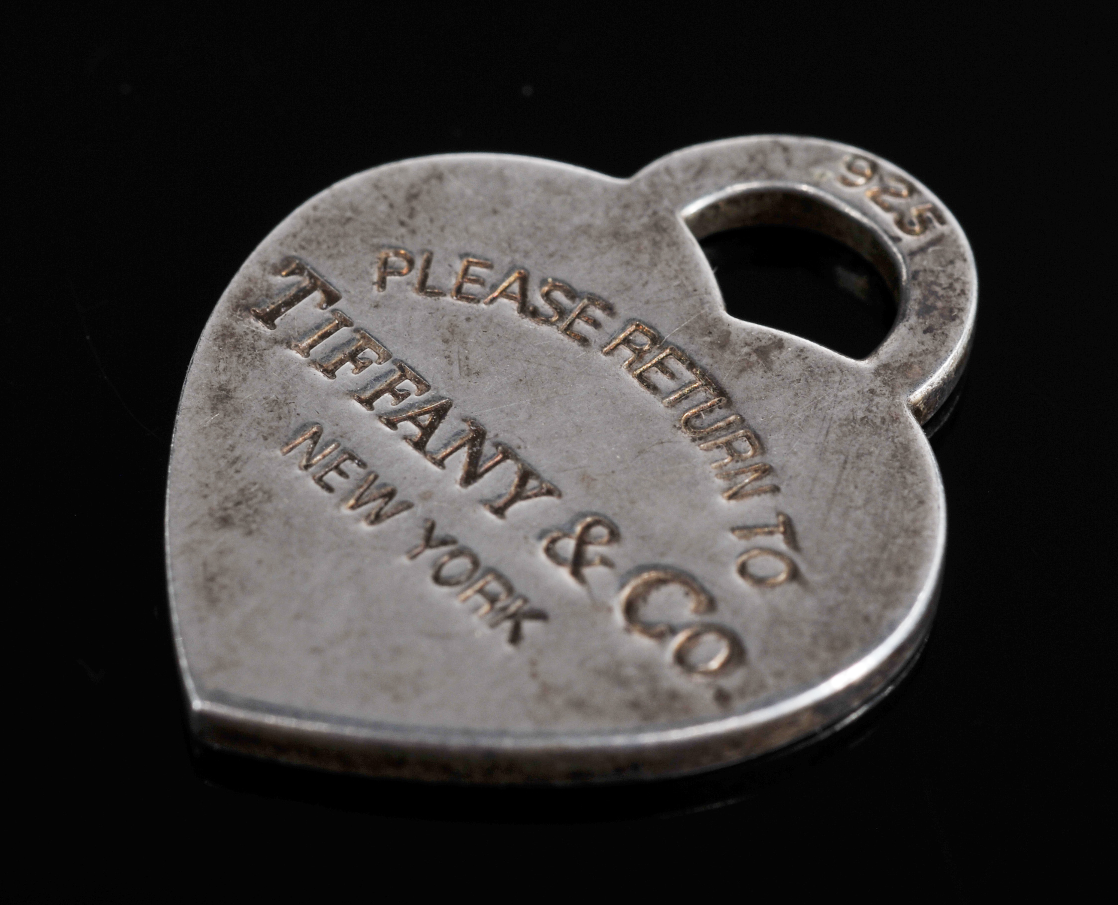 Tiffany & Co. Sterling Silver Heart shaped Pendant And Sterling Ribbon