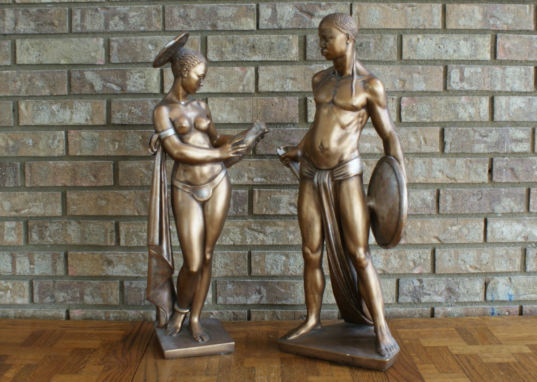 Mid Century African Woman and Man Head Statues