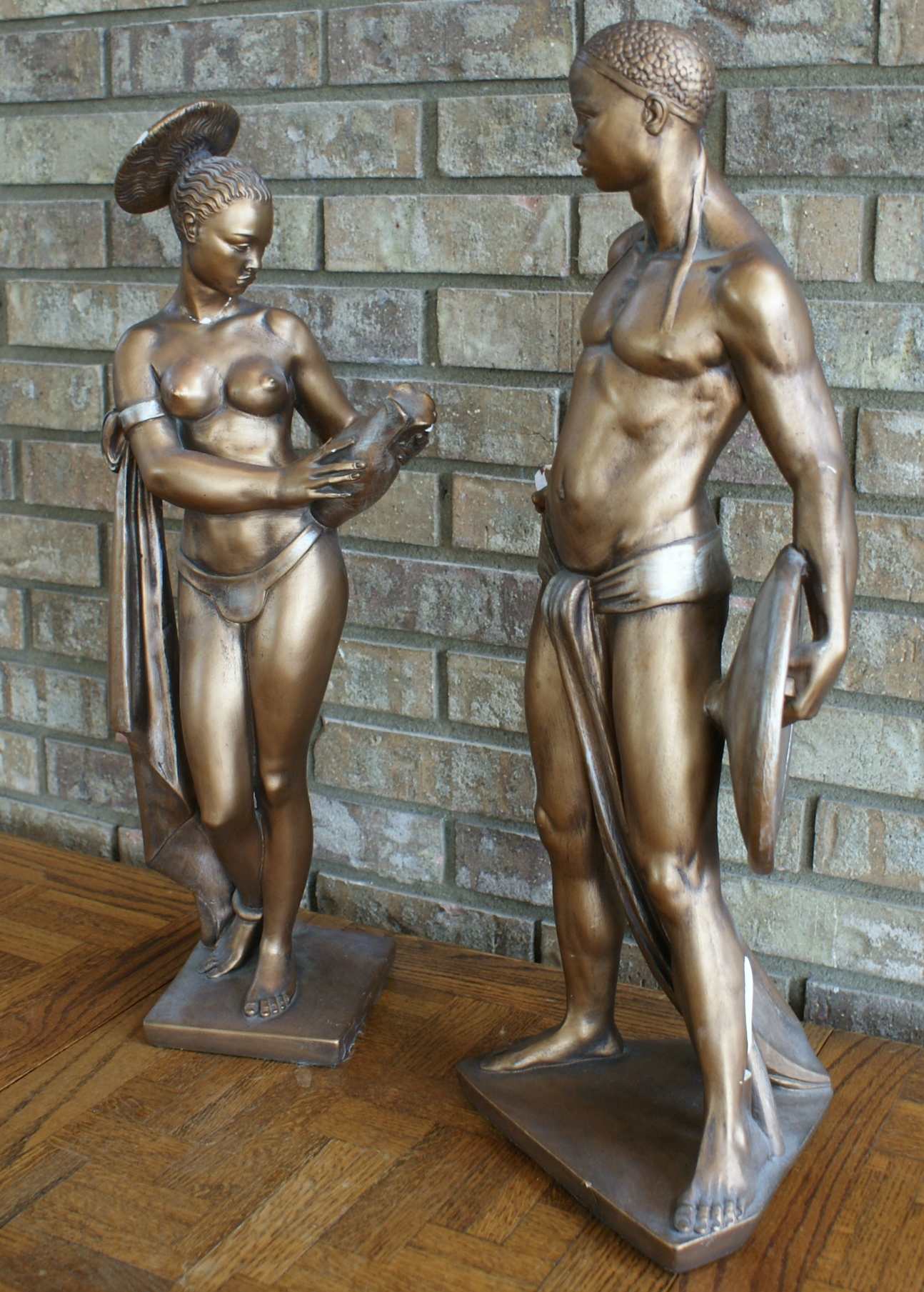 Mid Century African Woman and Man Head Statues