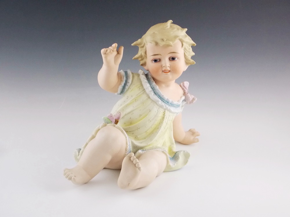 An Antique German Bisque Piano baby, Substantial in Size 