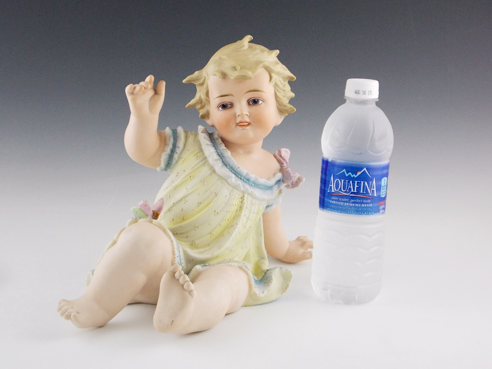 An Antique German Bisque Piano baby, Substantial in Size 