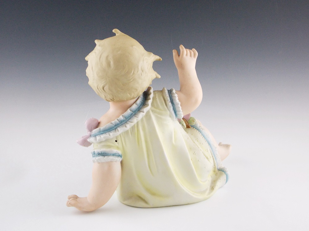 An Antique German Bisque Piano baby, Substantial in Size 