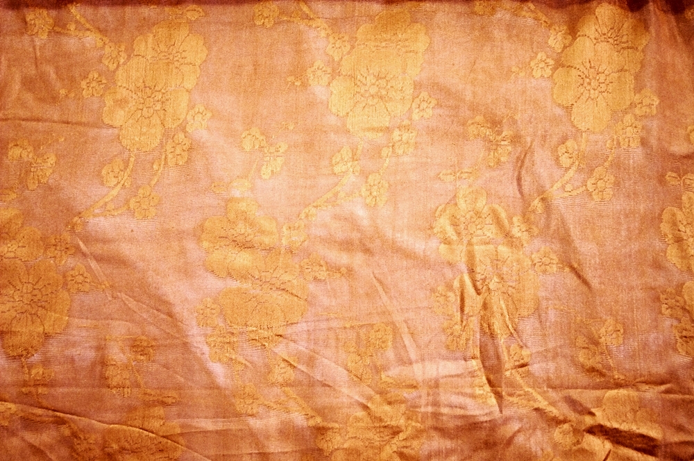 Bolt of Vintage Brocade Style fabric in Mandarin Orange with Cherry Blossoms