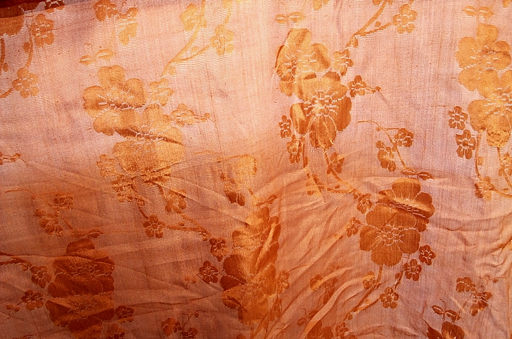 Bolt of Vintage Brocade Style fabric in Mandarin Orange with Cherry Blossoms