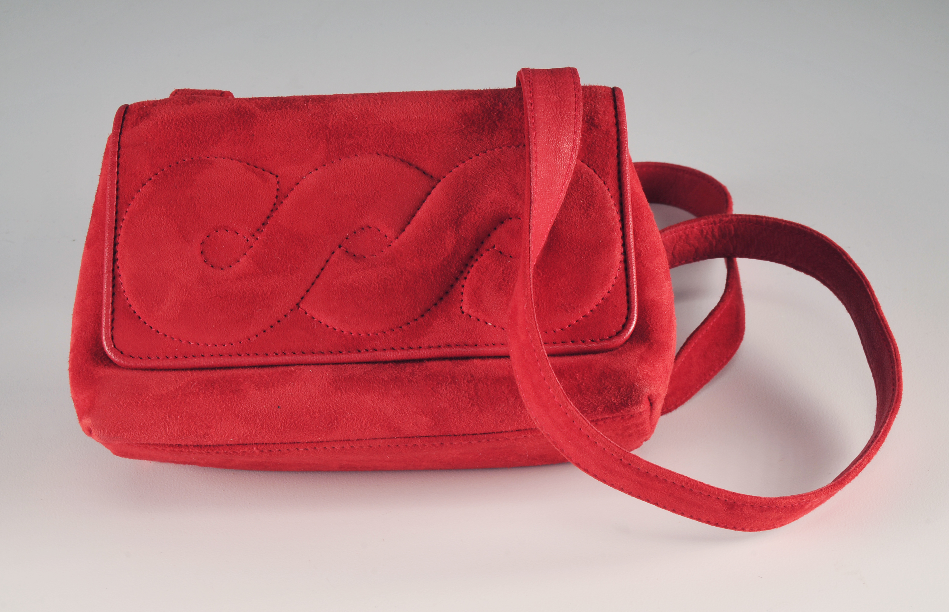  Renaud Pellegrino and Red Suede Handbag