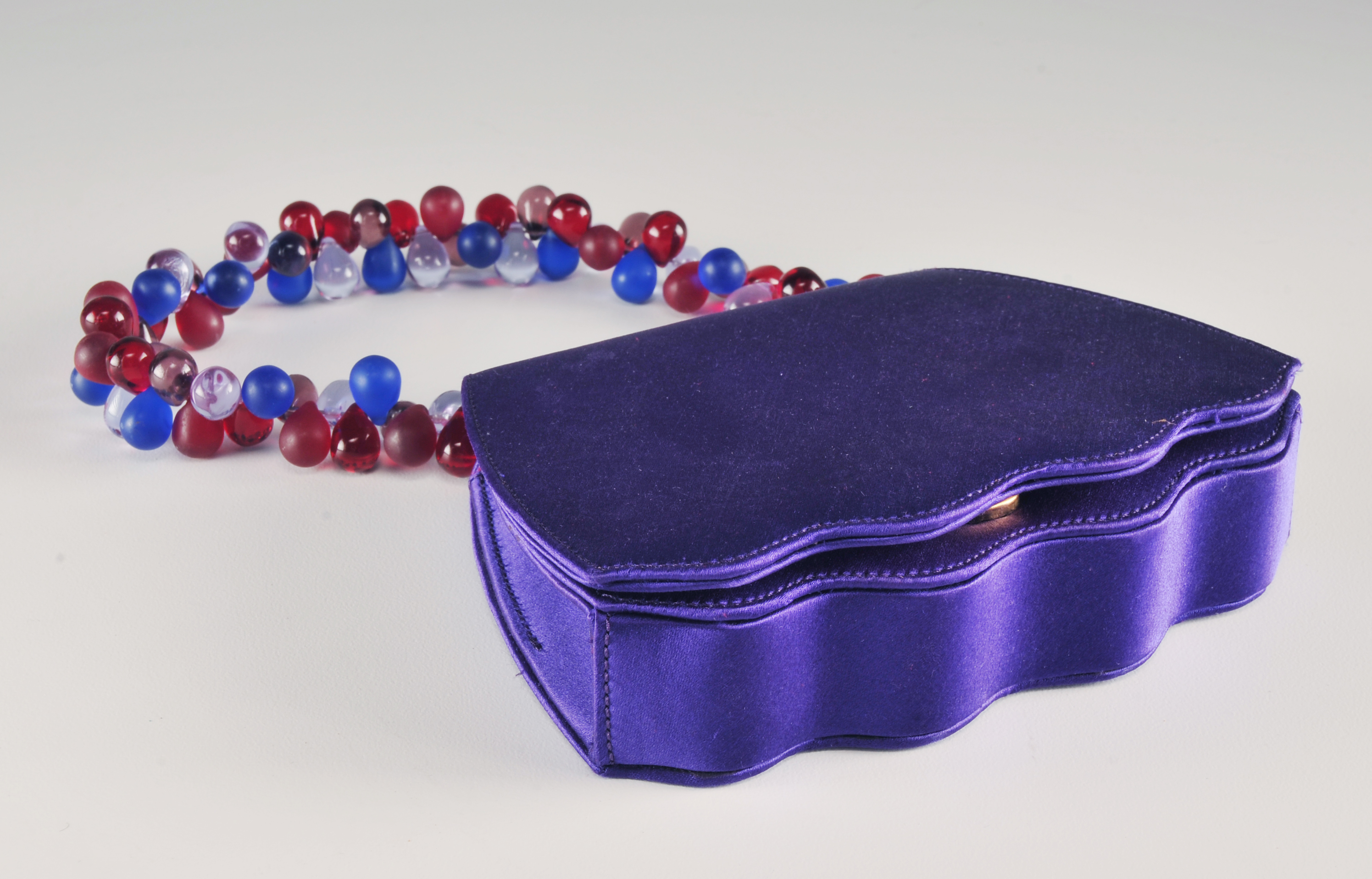  Renaud Pellegrino and Red Suede Handbag