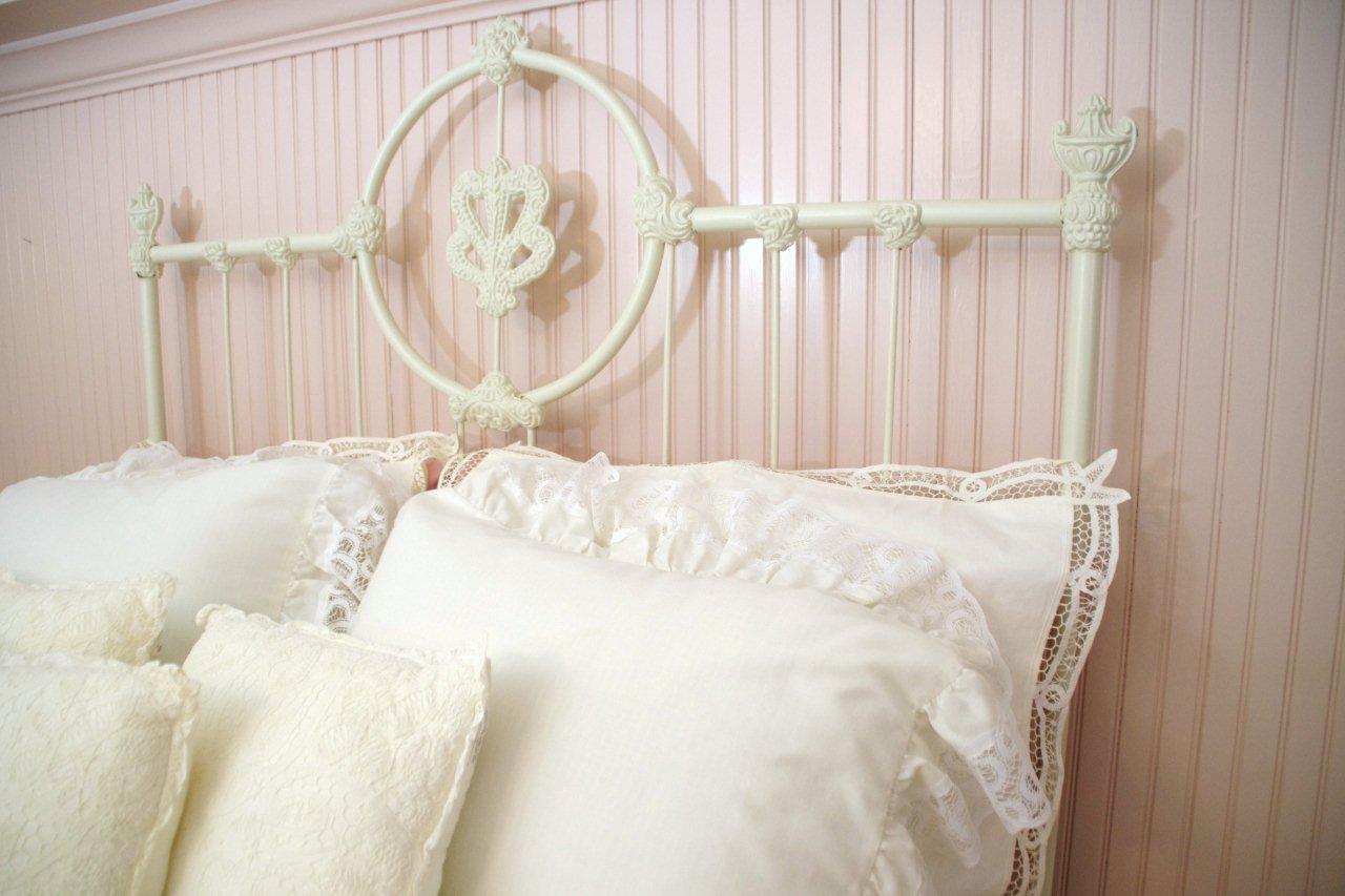 Victorian Style Cast Iron Bed, with white painted finish and white lace comforter set