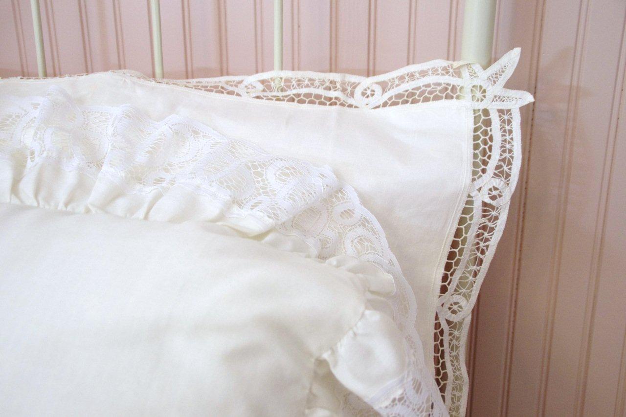 Victorian Style Cast Iron Bed, with white painted finish and white lace comforter set