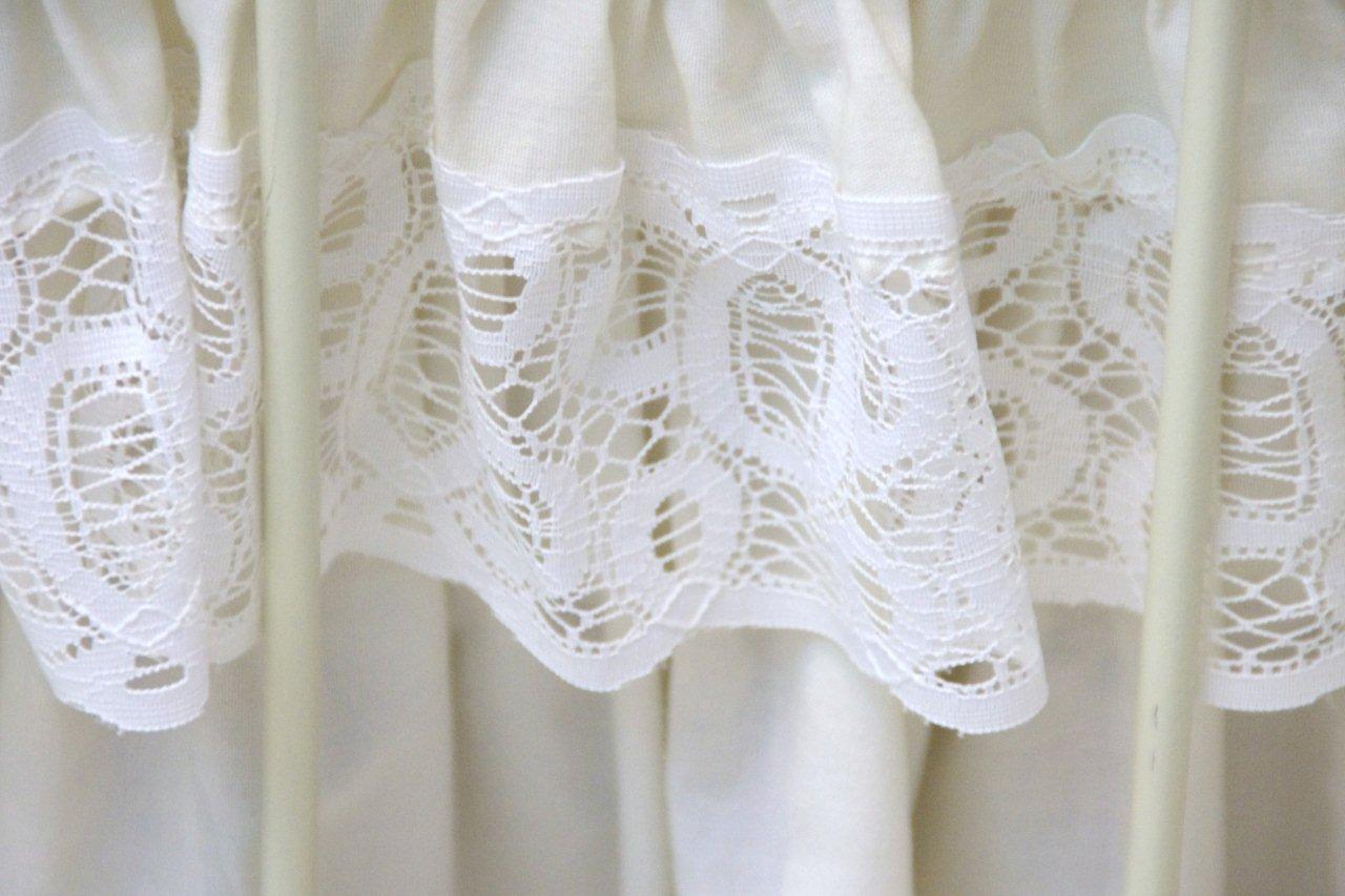 Victorian Style Cast Iron Bed, with white painted finish and white lace comforter set