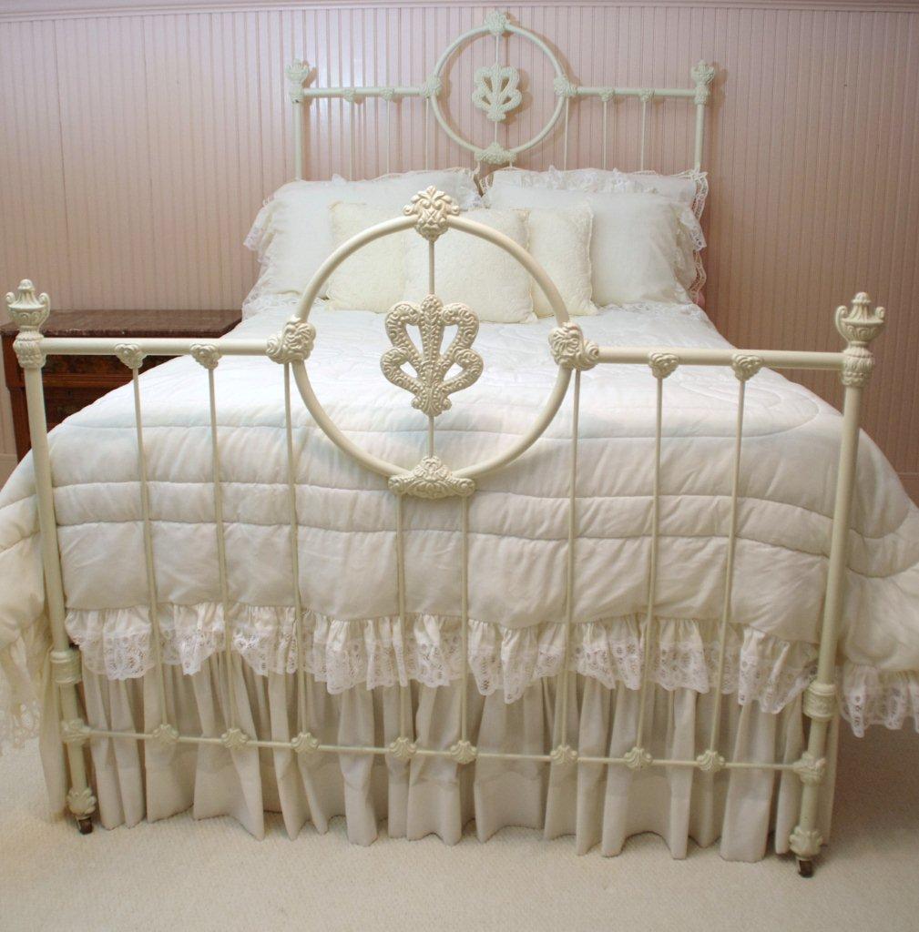 Victorian Style Cast Iron Bed, with white painted finish and white lace comforter set