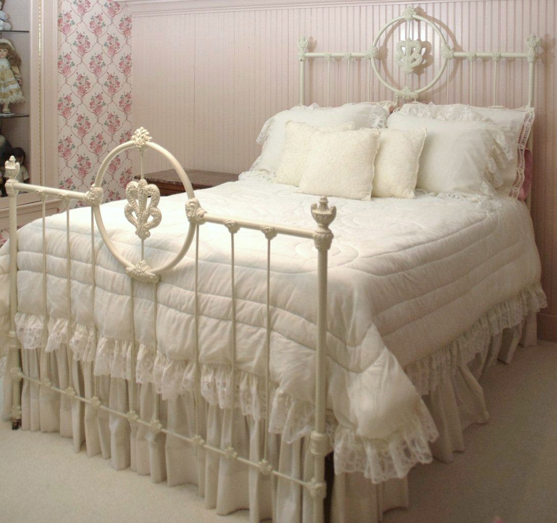 Victorian Style Cast Iron Bed, with white painted finish and white lace comforter set