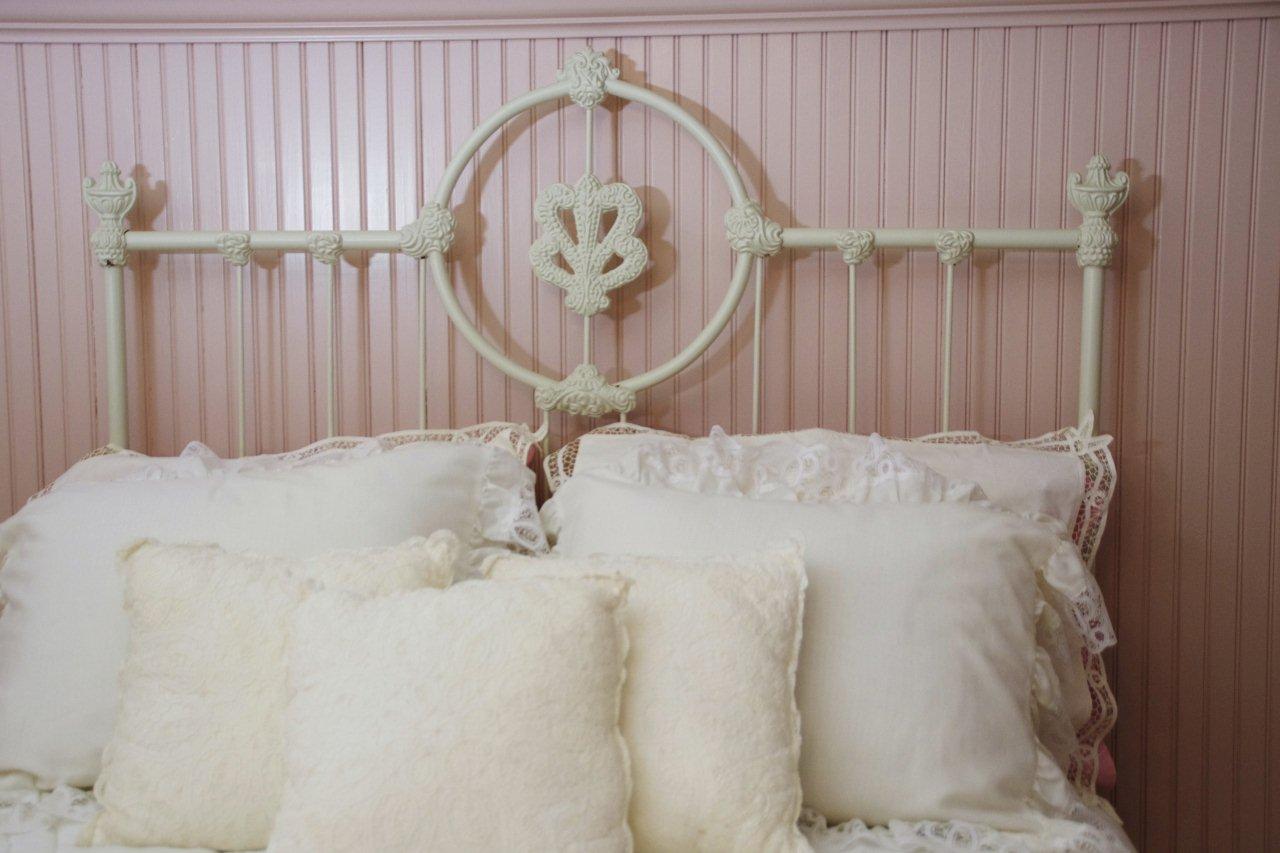 Victorian Style Cast Iron Bed, with white painted finish and white lace comforter set