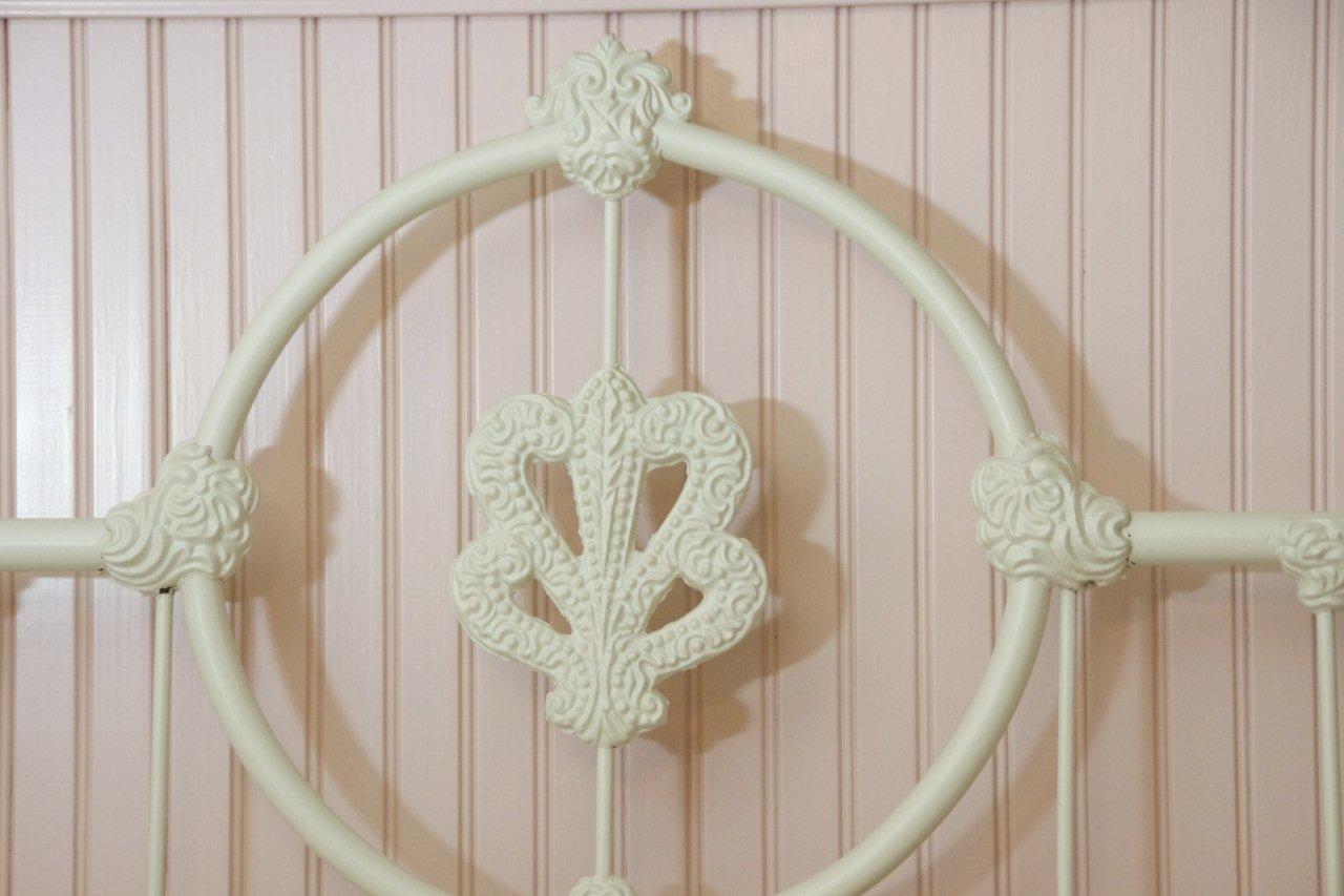 Victorian Style Cast Iron Bed, with white painted finish and white lace comforter set