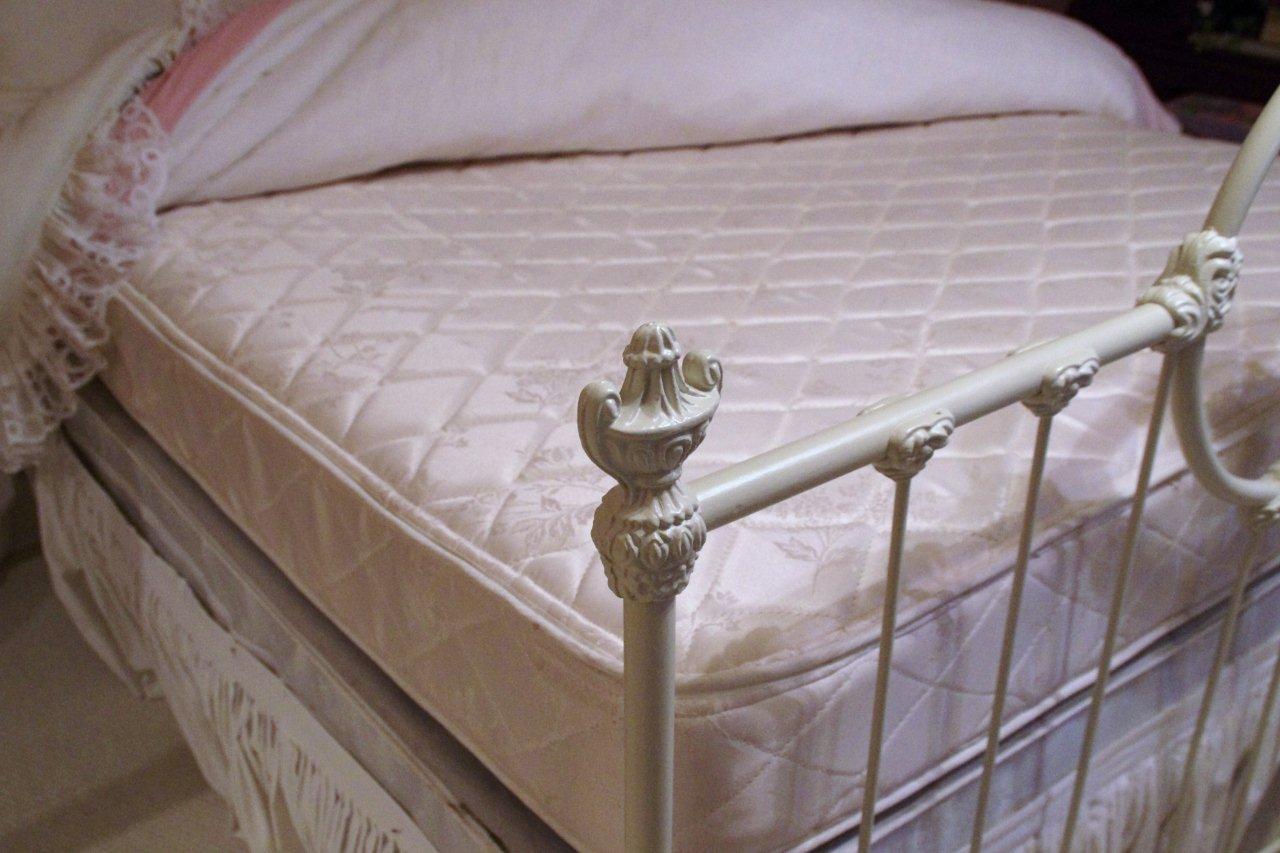 Victorian Style Cast Iron Bed, with white painted finish and white lace comforter set