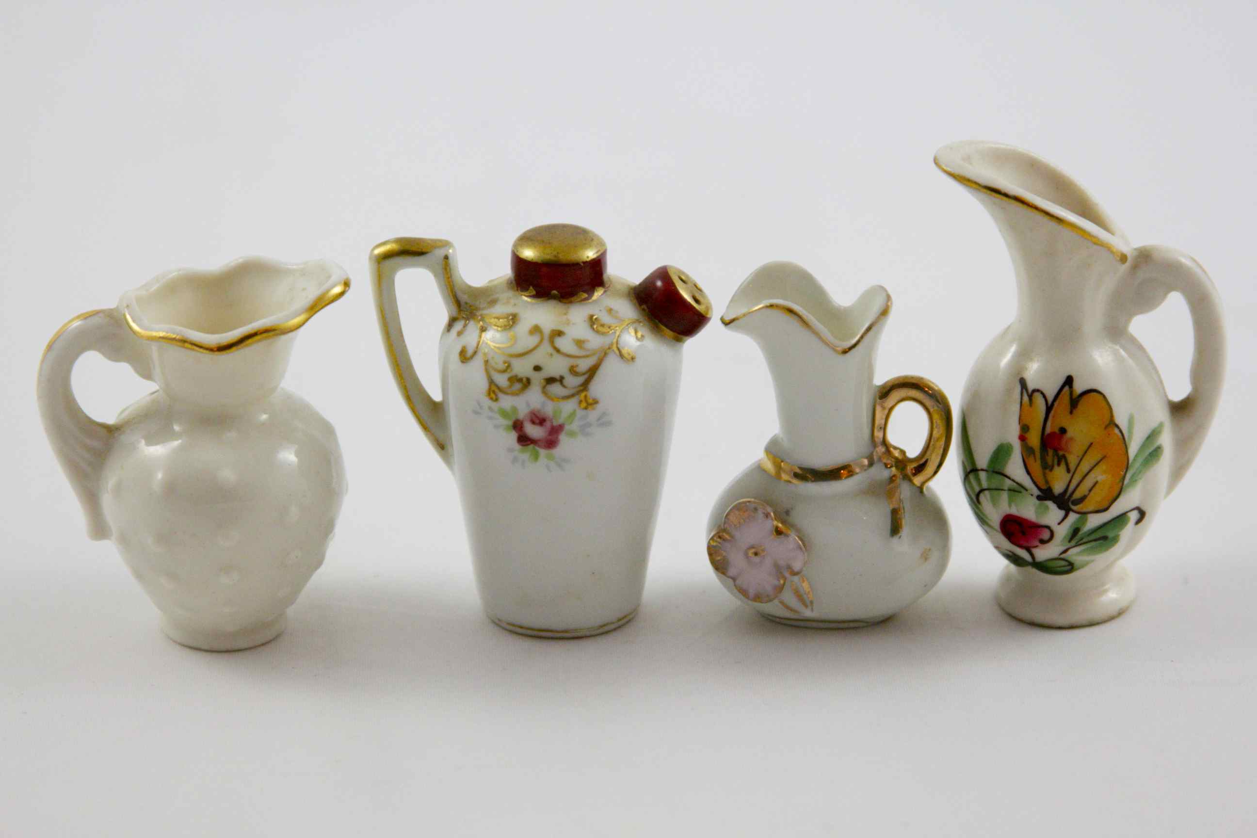 Porcelain Pitcher Figurines 