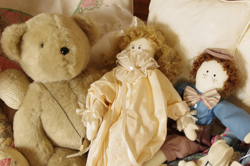 Cast Iron Crib, circa 1940-50, filled with Dolls, Bunnies, and Lace Pillows