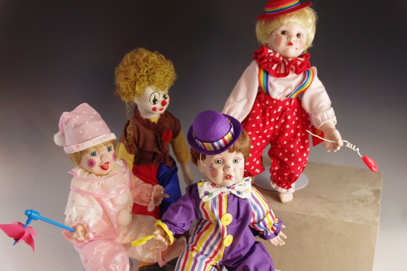 Collection of Mary Tretter Porcelain Dolls, dressed as Clowns