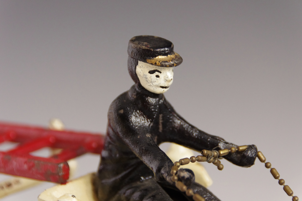 Antique Cast Iron Toy Fire Wagon, with two Drivers and Team of Galloping Horses