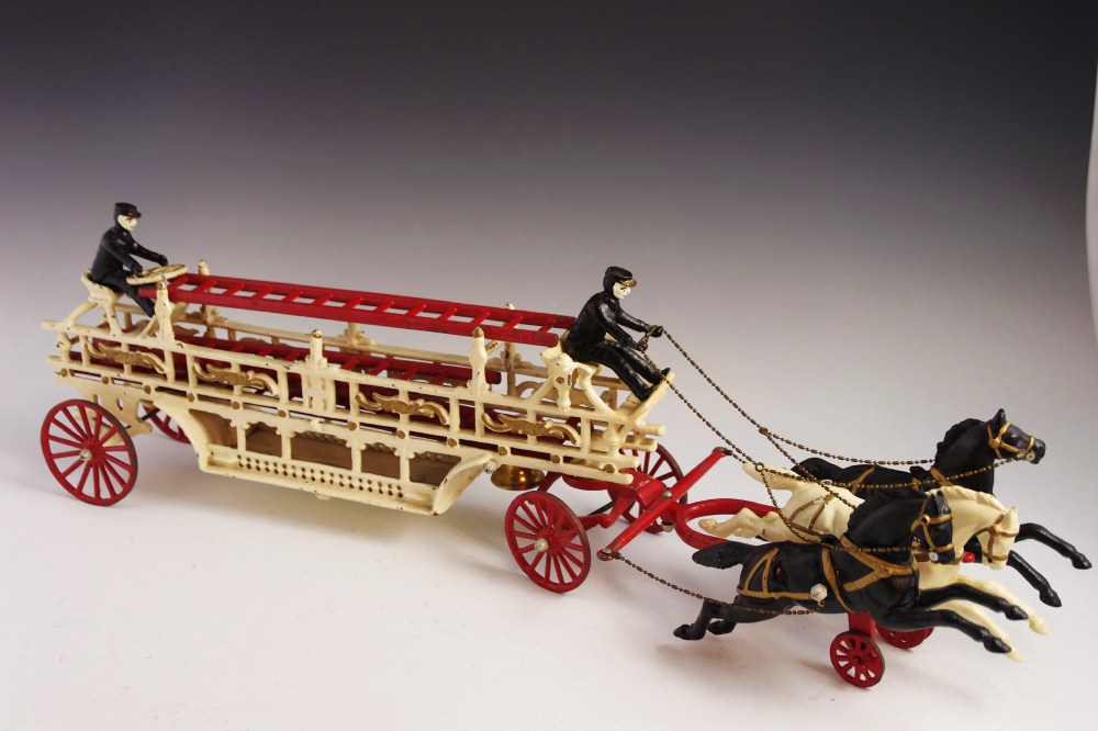 Antique Cast Iron Toy Fire Wagon, with two Drivers and Team of Galloping Horses