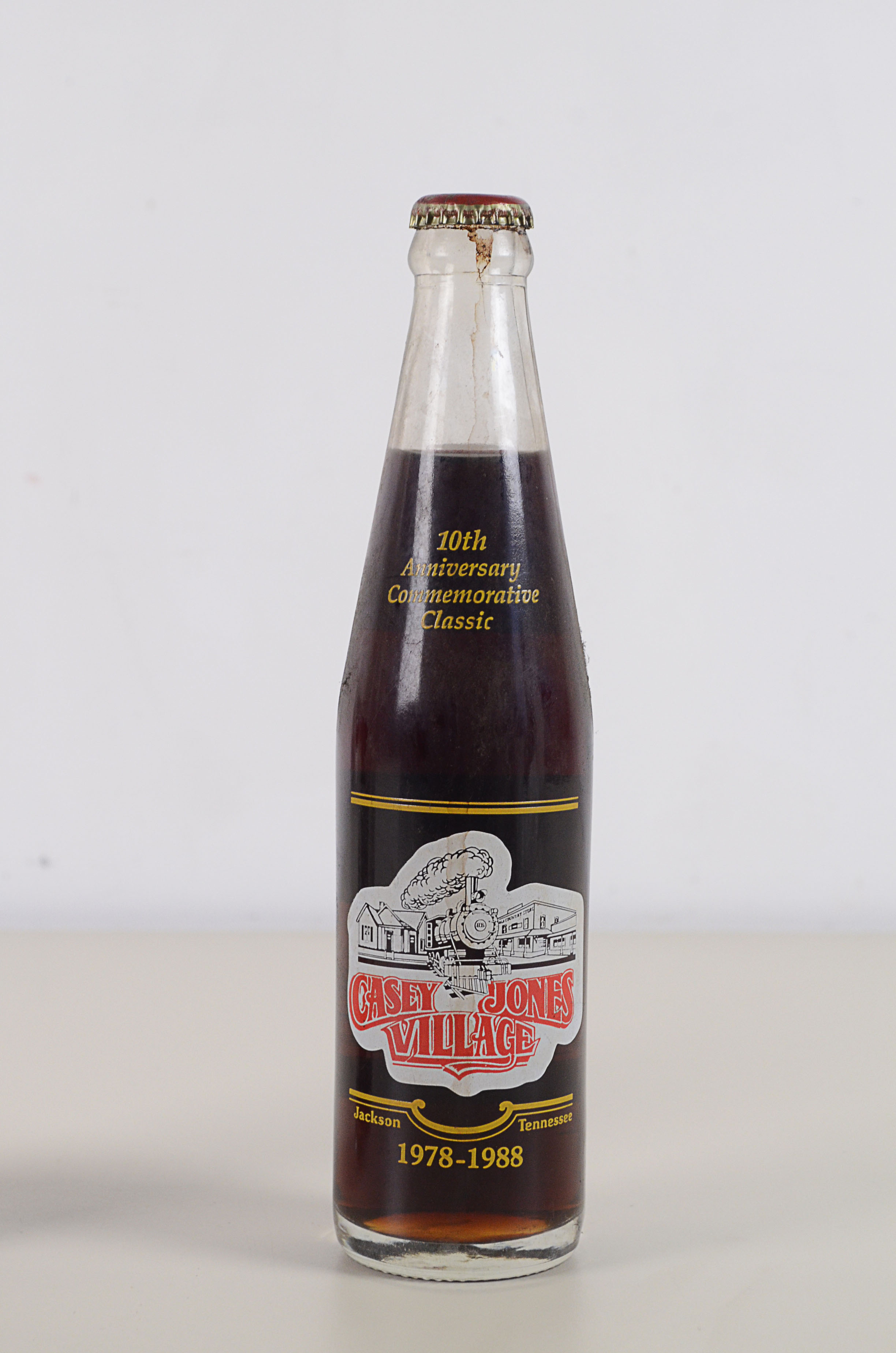 Two Vintage Commemorative Coke Bottles