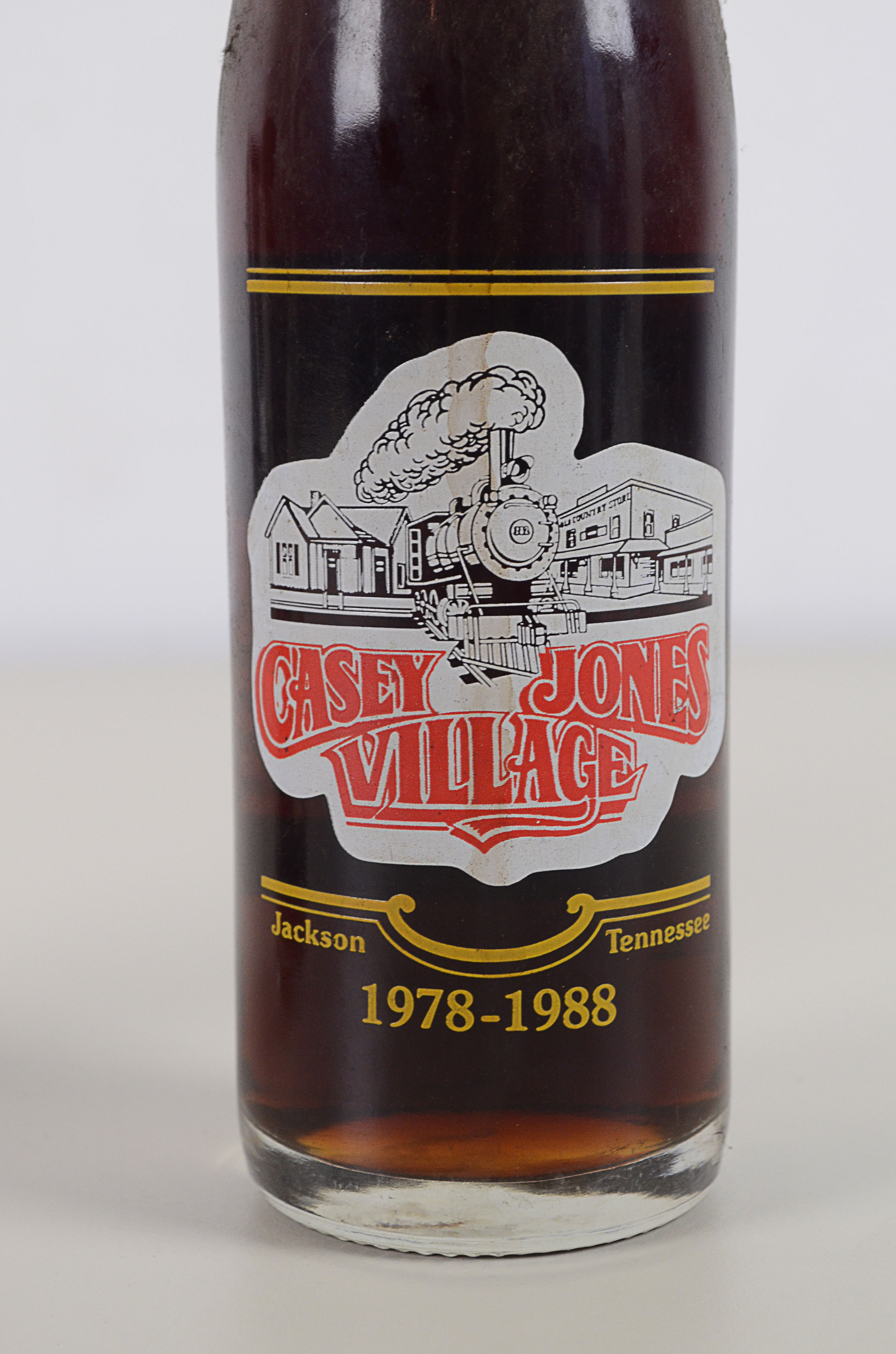 Two Vintage Commemorative Coke Bottles