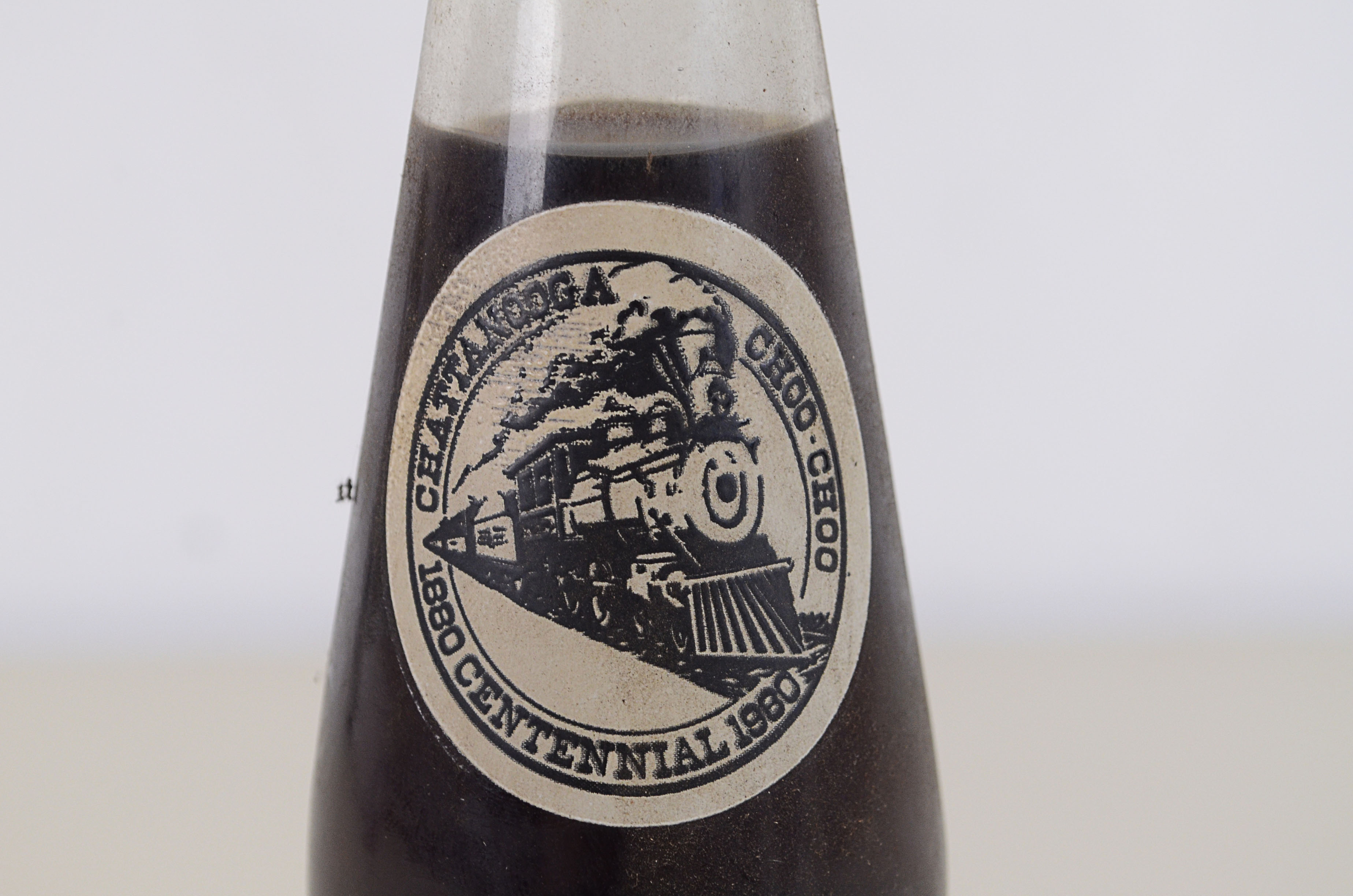 Two Vintage Commemorative Coke Bottles