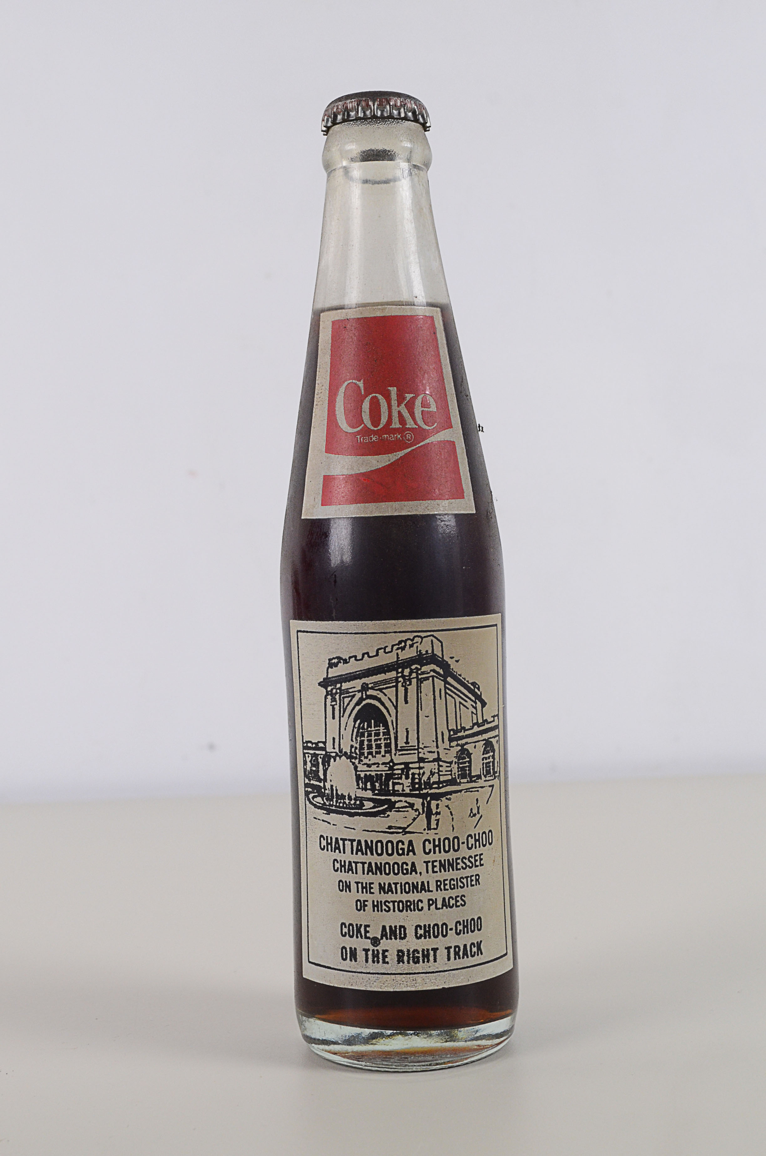 Two Vintage Commemorative Coke Bottles