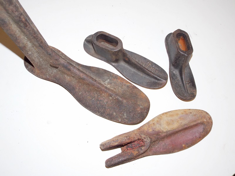 A Collection Antique Cast Iron and Wooden Shoe Forms