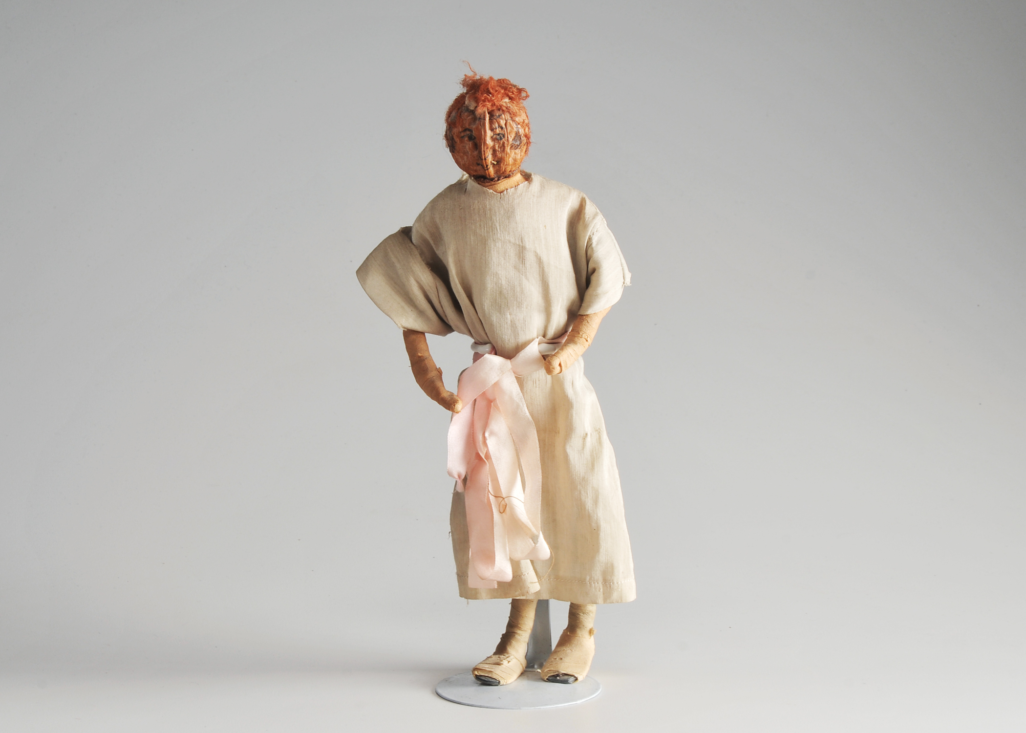 Folk Art Peach Pit Figurine