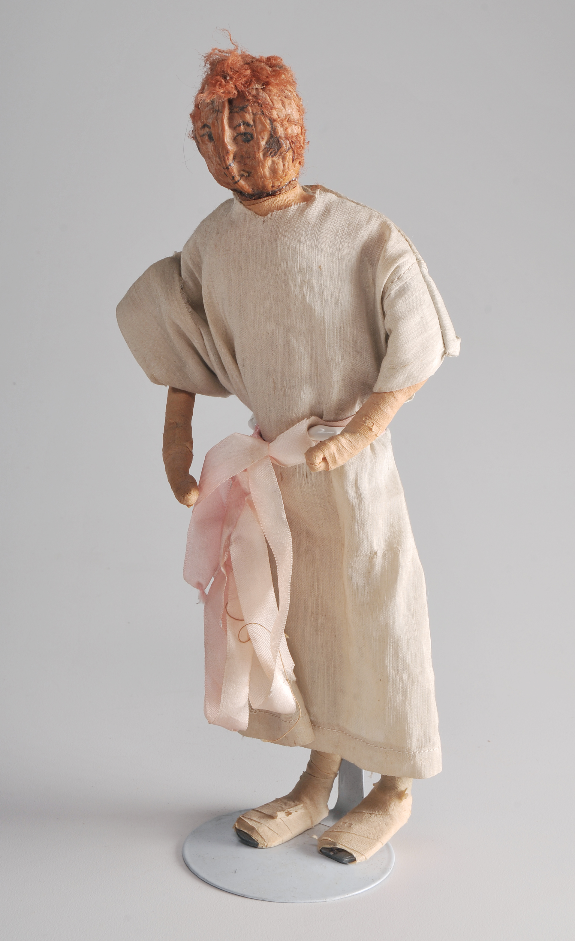 Folk Art Peach Pit Figurine