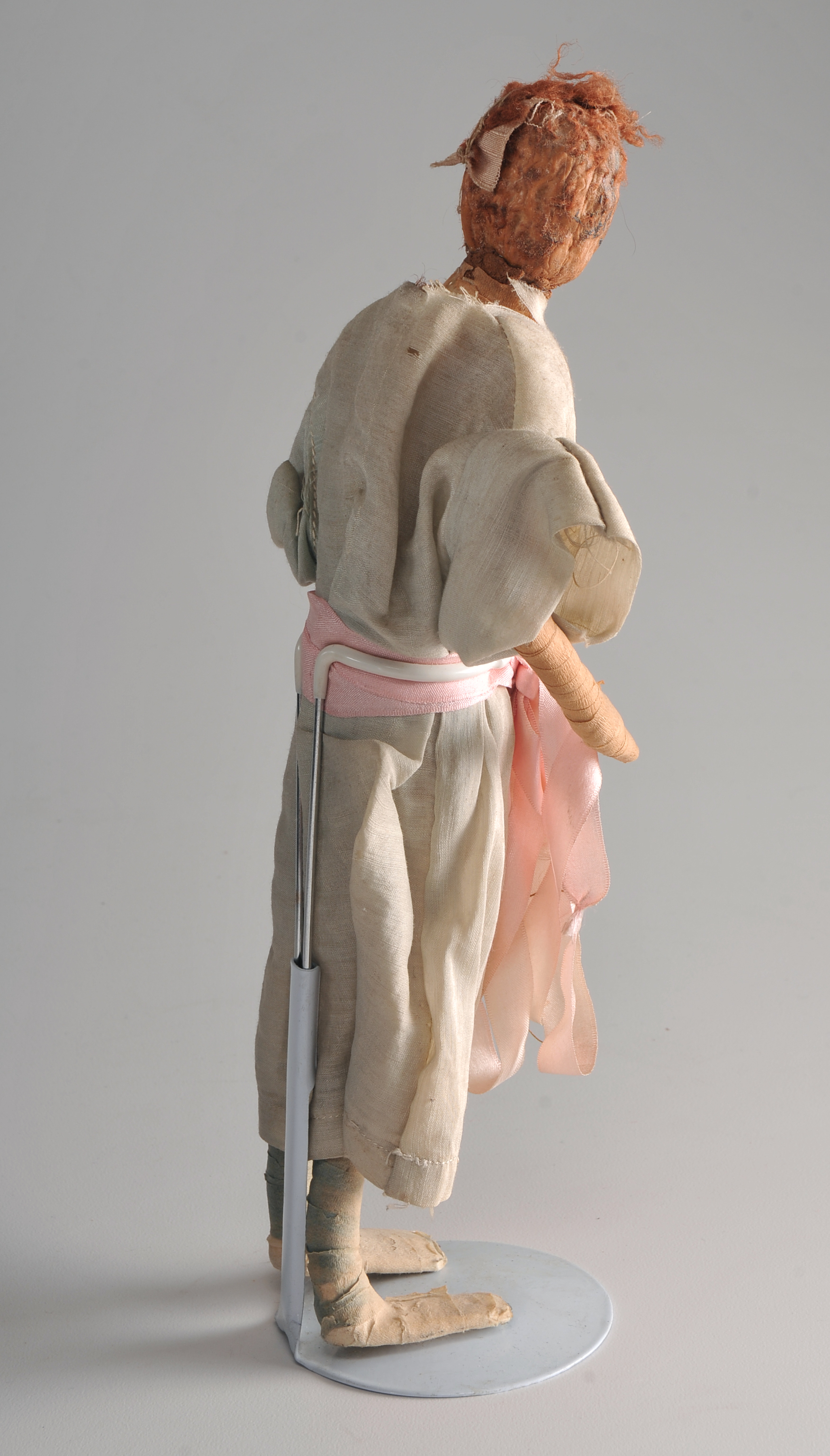 Folk Art Peach Pit Figurine