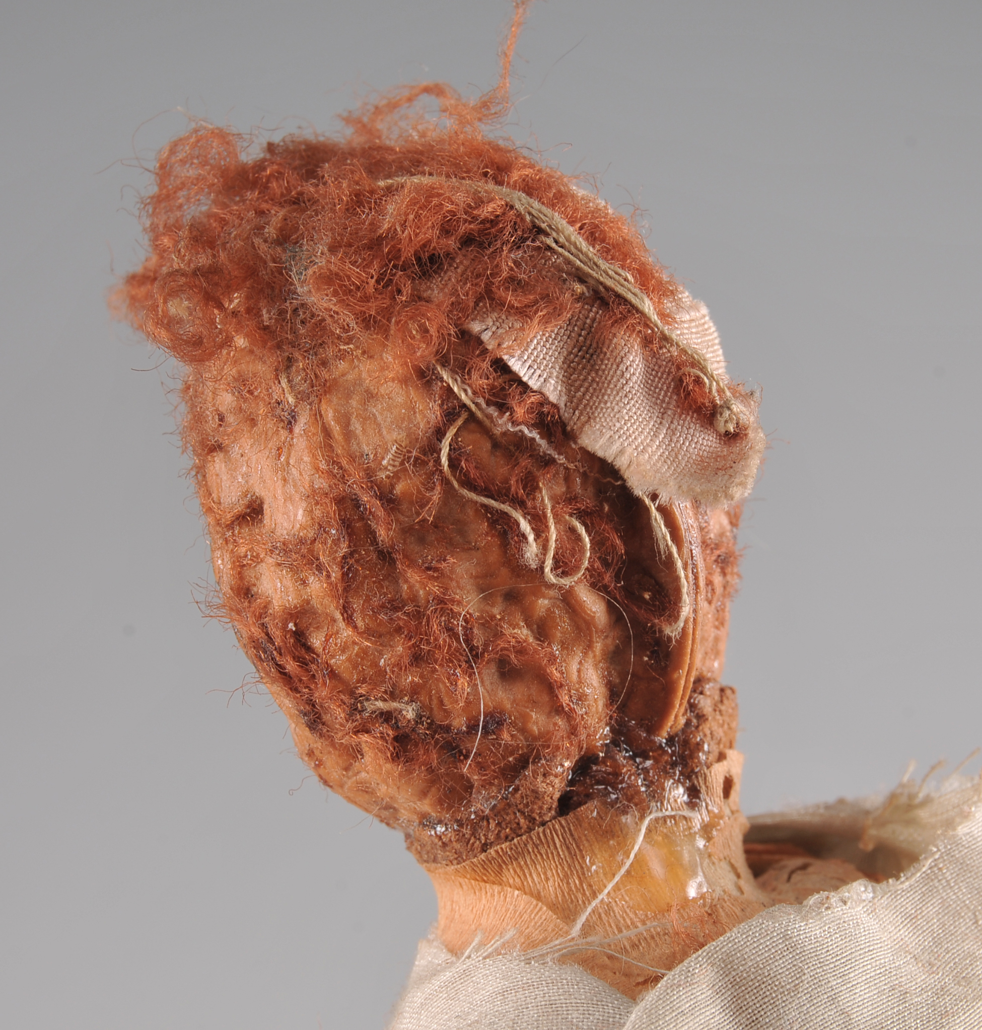 Folk Art Peach Pit Figurine