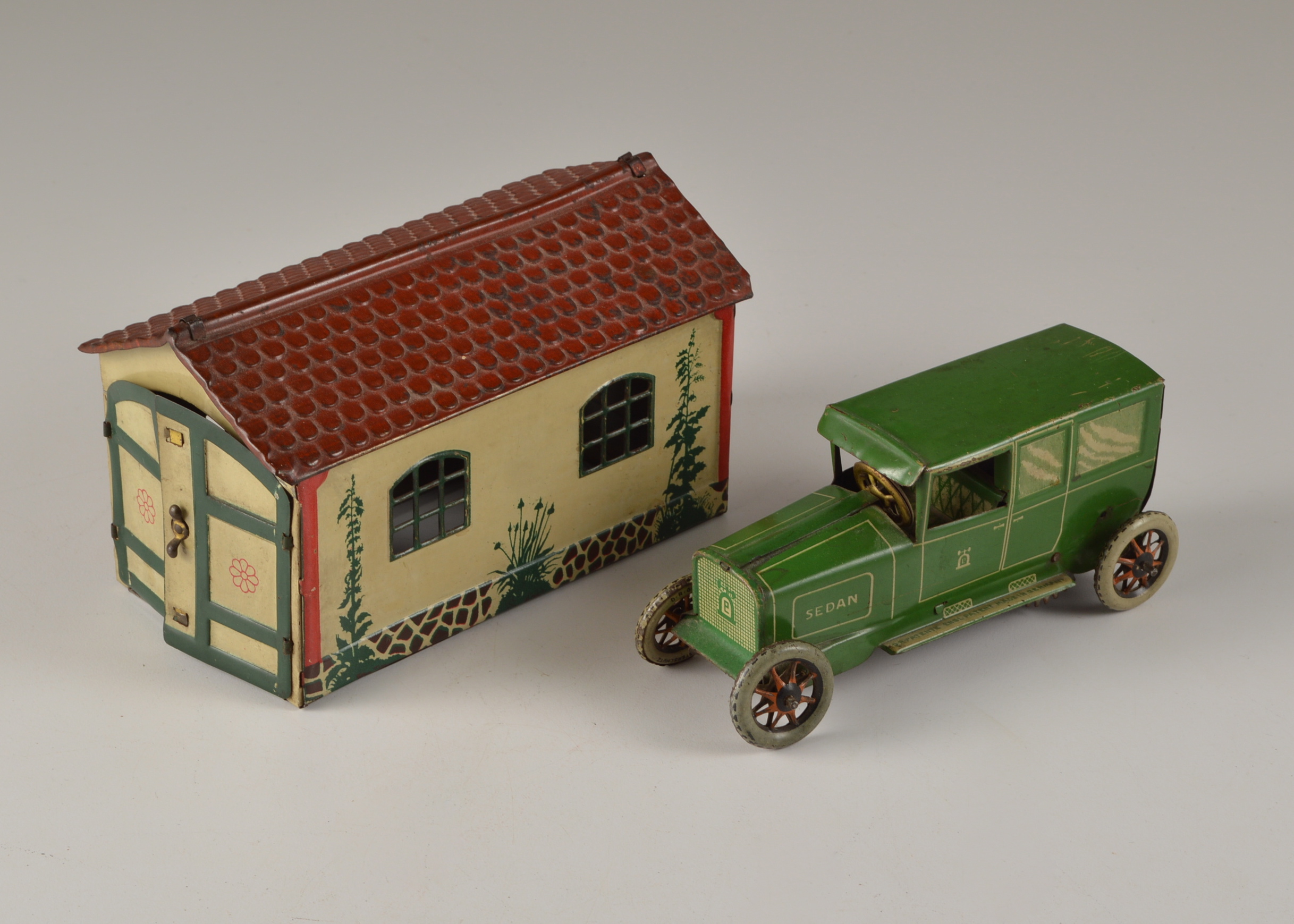 Lehman Tin Litho Wind Up Car and  Garage