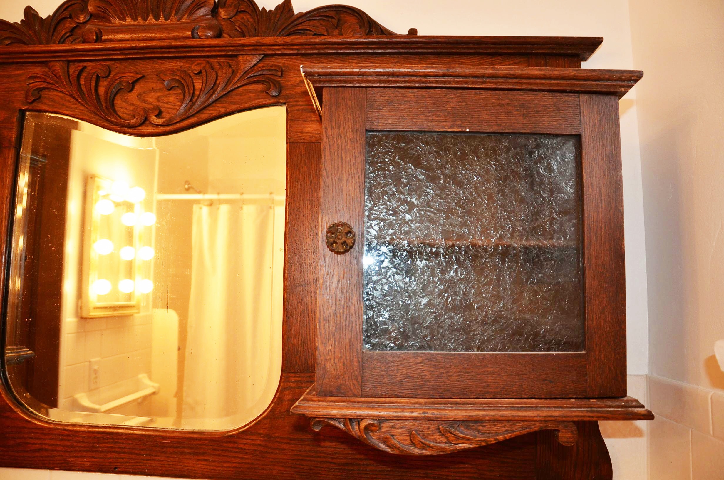 Oak Mirror Flanked by Cabinets