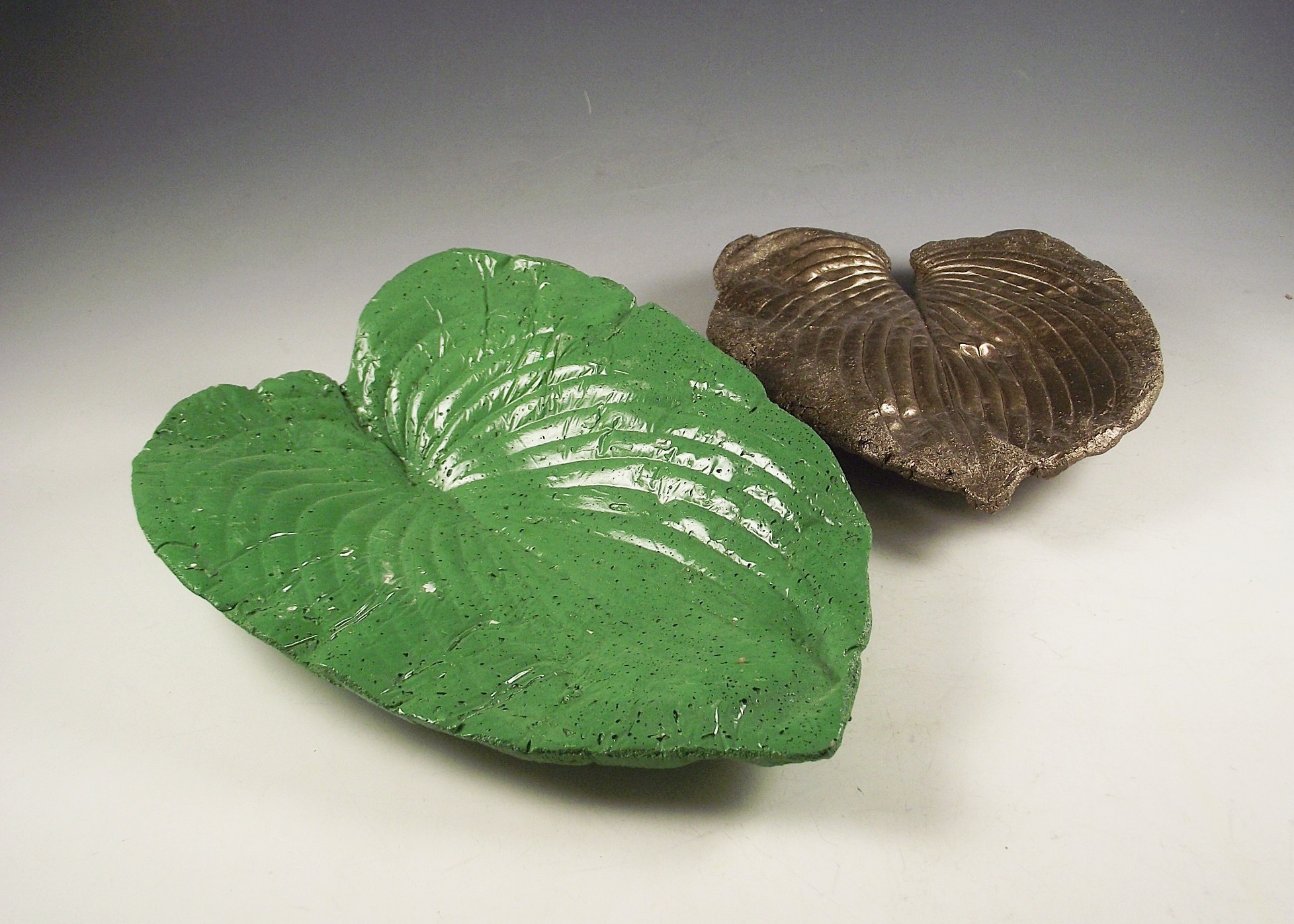 Two Pottery Leaf Shaped Decorations