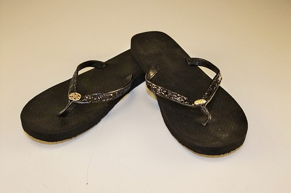 Pair of Tory Burch Black Adia Glitter Flip Flops with Goldtone Log