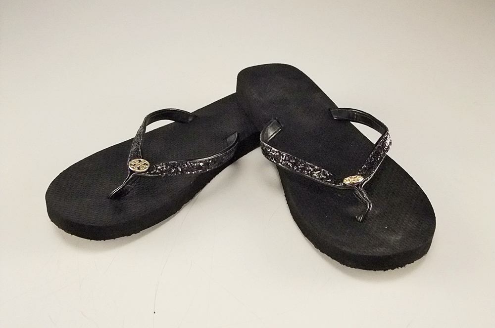 Pair of Tory Burch Black Adia Glitter Flip Flops with Goldtone Log